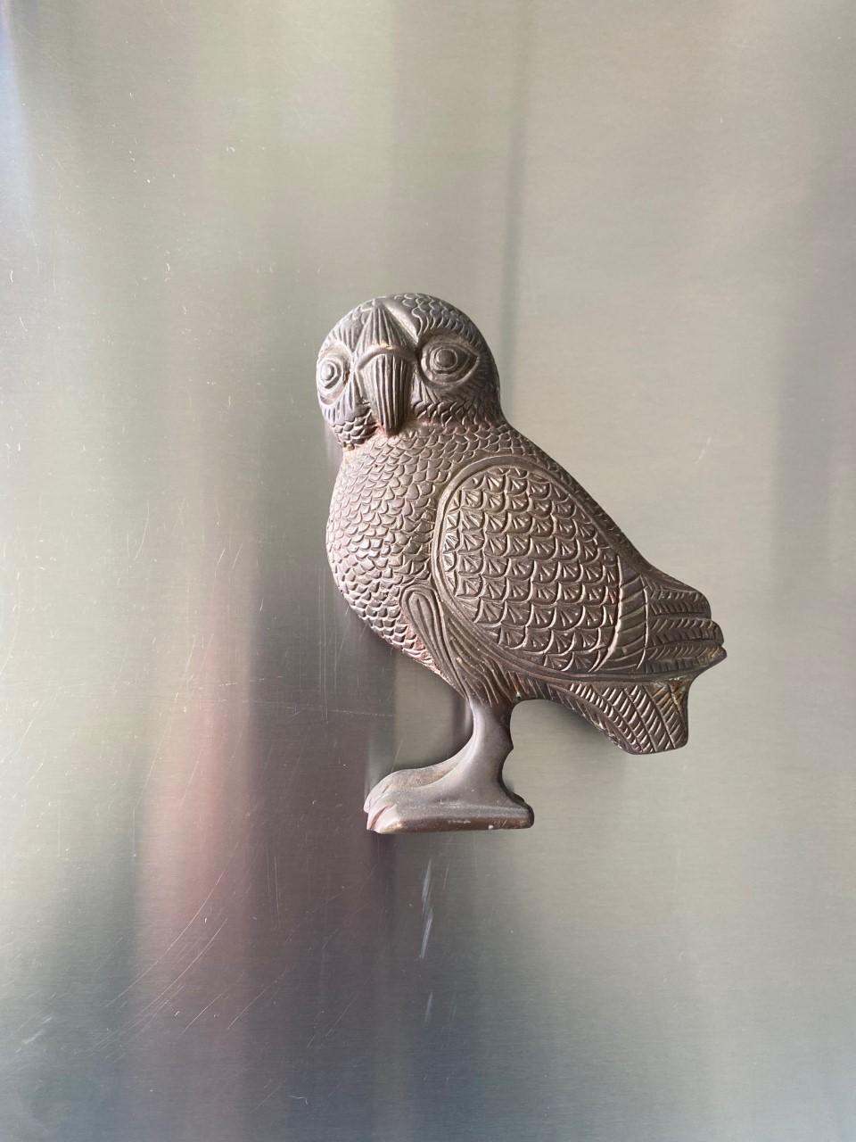 Enigmatic and sublime bronze sculpture of owl of Athena. Traditionally a companion to the goddess of wisdom, the owl representation has been associated with knowledge and wisdom. This mid century representation in bronze of the owl of Athena
