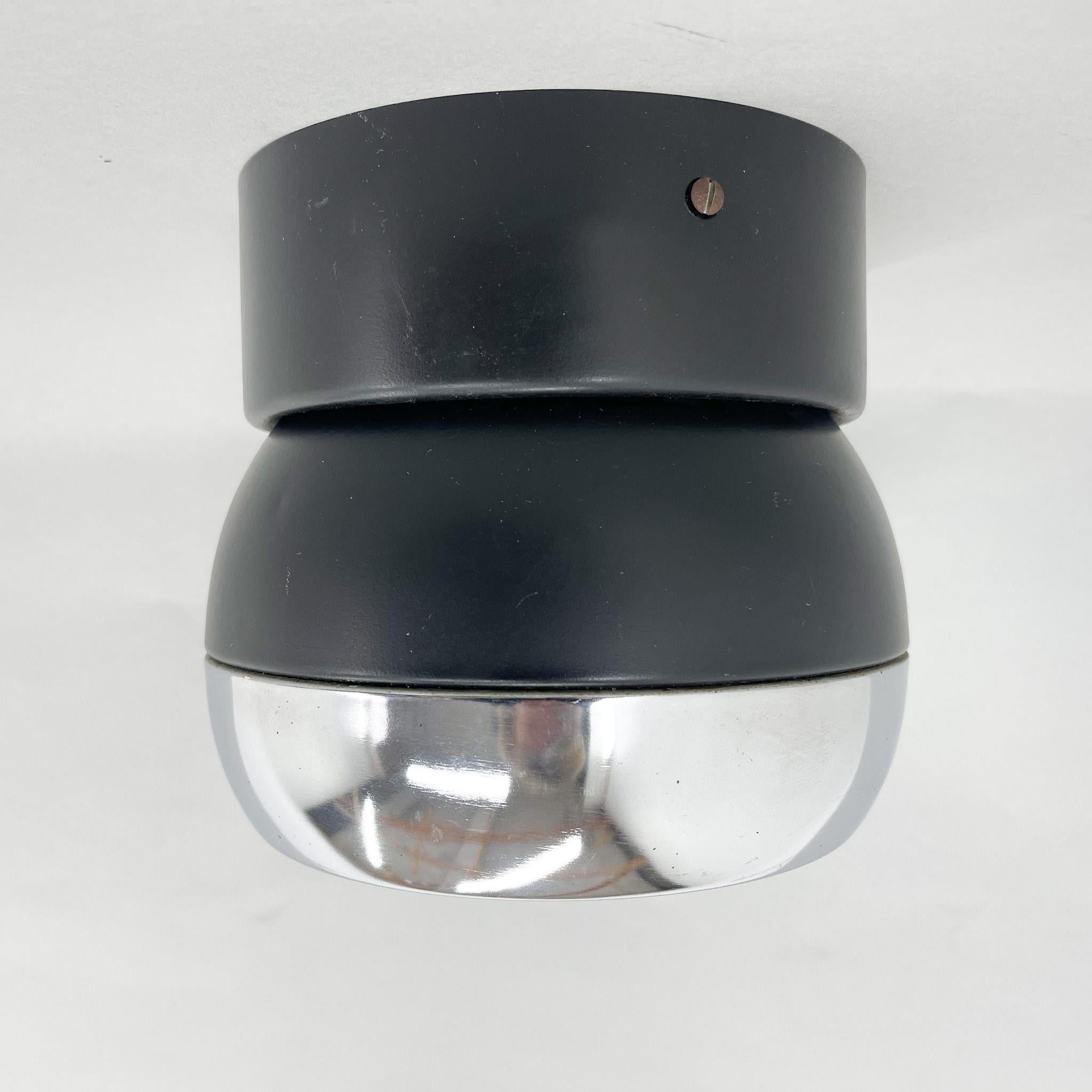 Vintage ceiling or wall light made of metal with chrome rim. Moves in on direction. Made in former Czechoslovakia by the famous Napako in the 1980s.