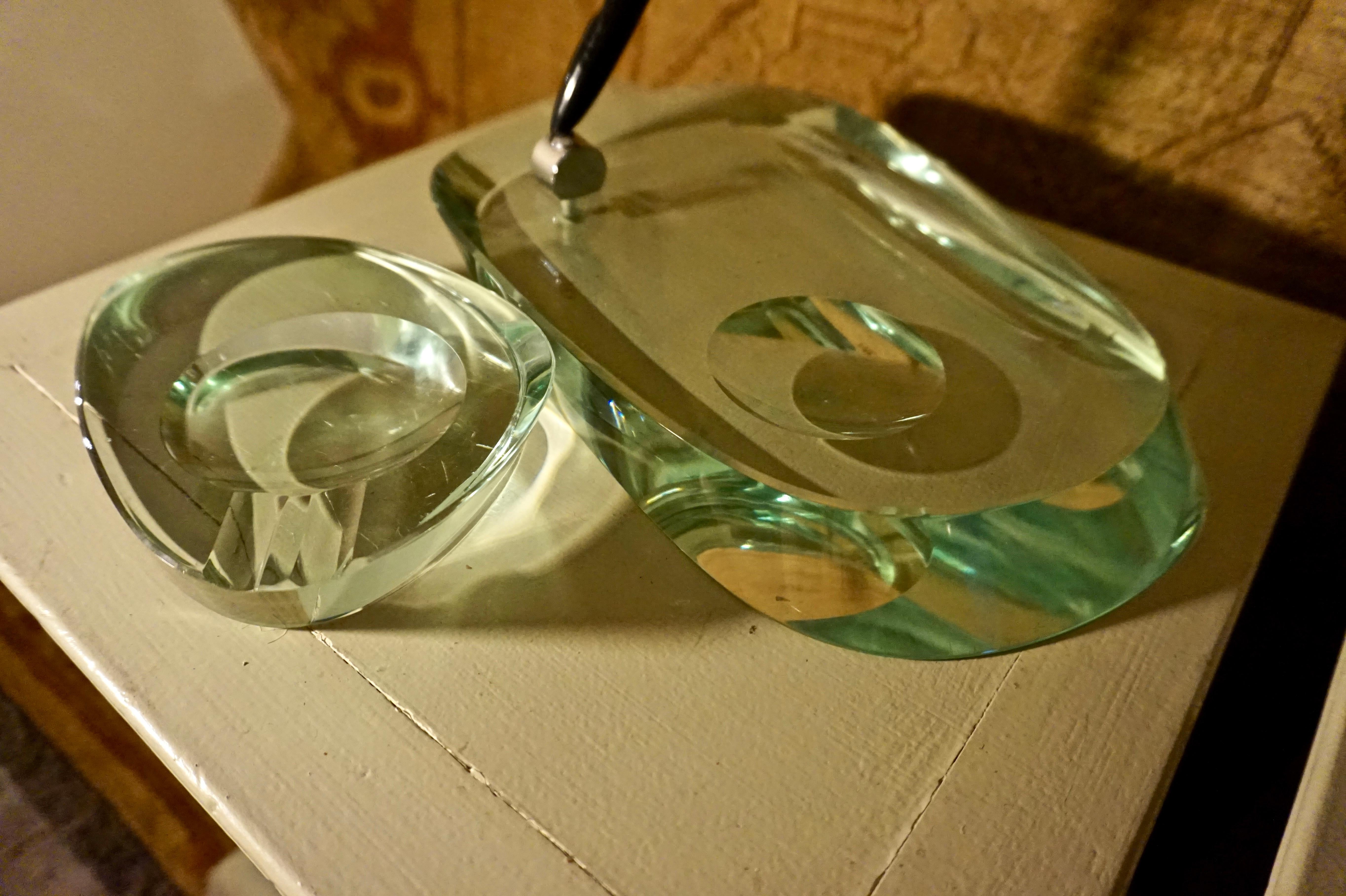 Circa 1950's

Thick slabs of light sea green glass pen stand and ashtray desk set by the esteemed Fontana Arte company. Original condition down to pen holder screw. Minor scratches consistent with age but shows beautifully and exudes gravitas.