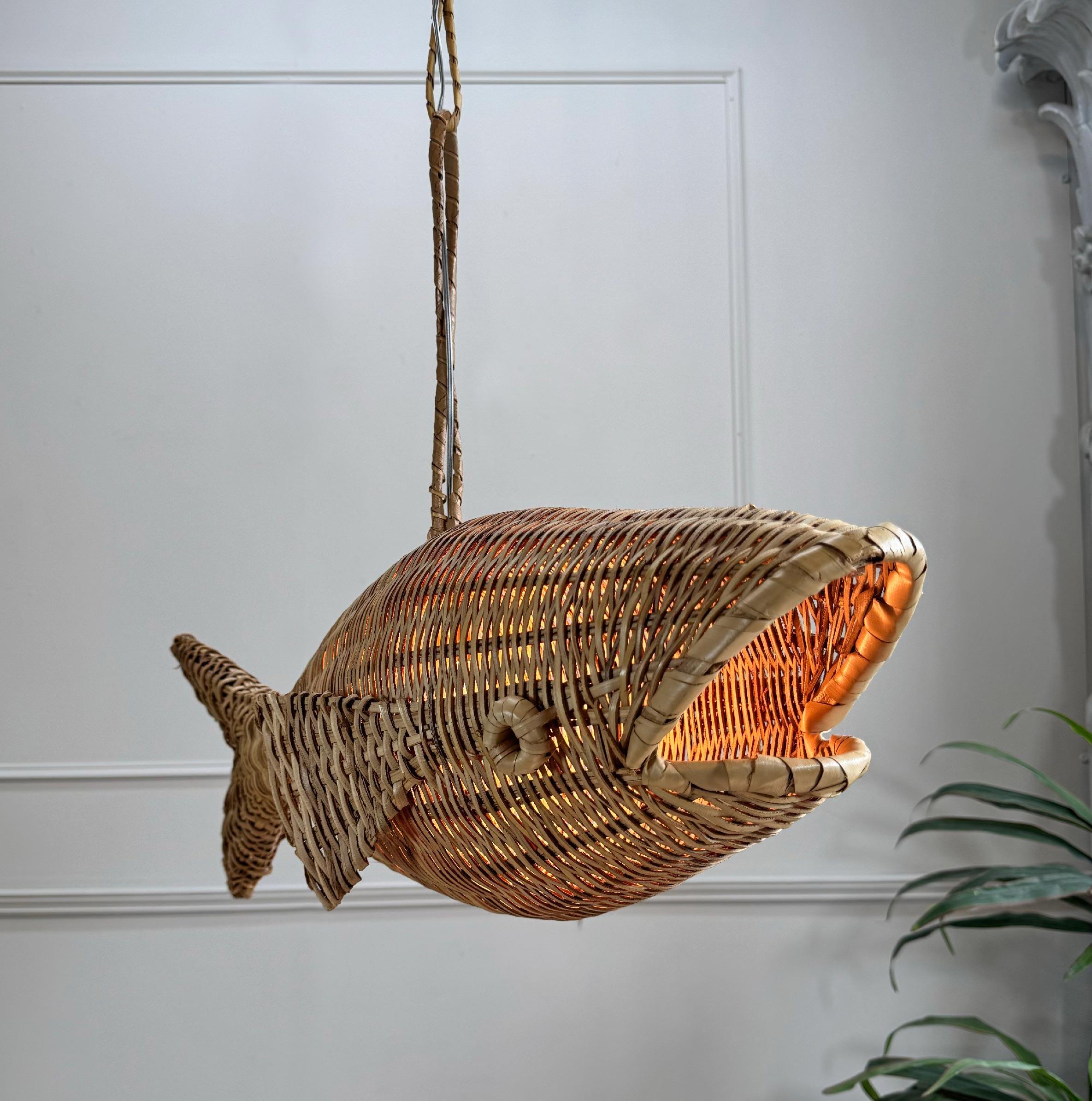 Superb 1960’s wicker fish ceiling light, French. Due to their nature these original ceiling lights are incredibly rare to find from this period and especially in such good condition.

The single e27 lamp holder sits inside the body of the Fish, the