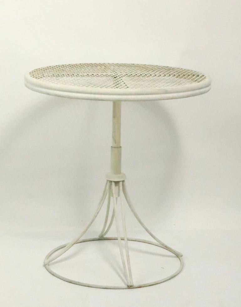 Hard to find adjustable side table by Homecrest, having a circular mesh top ( 21 inch Dia. ) and adjustable pole base ( High Position 26 x Low Position 14 inch ) Clean original condition showing only light cosmetic wear, normal and consistent with