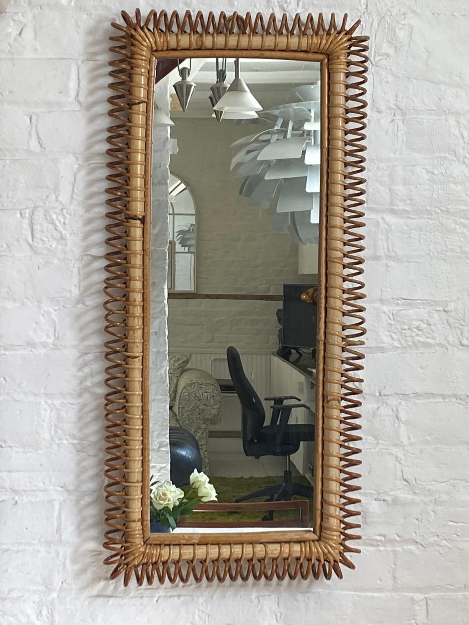Rare Mid Century Italian Rattan Bamboo Wall Mirror Franco Albini, Italian, 1960s 

Superb mid-century rectangular rattan wall mirror. This Mid-Century Modern mirror is attributed to Franco Albini and was produced in the 1960s in Italy by Vittorio