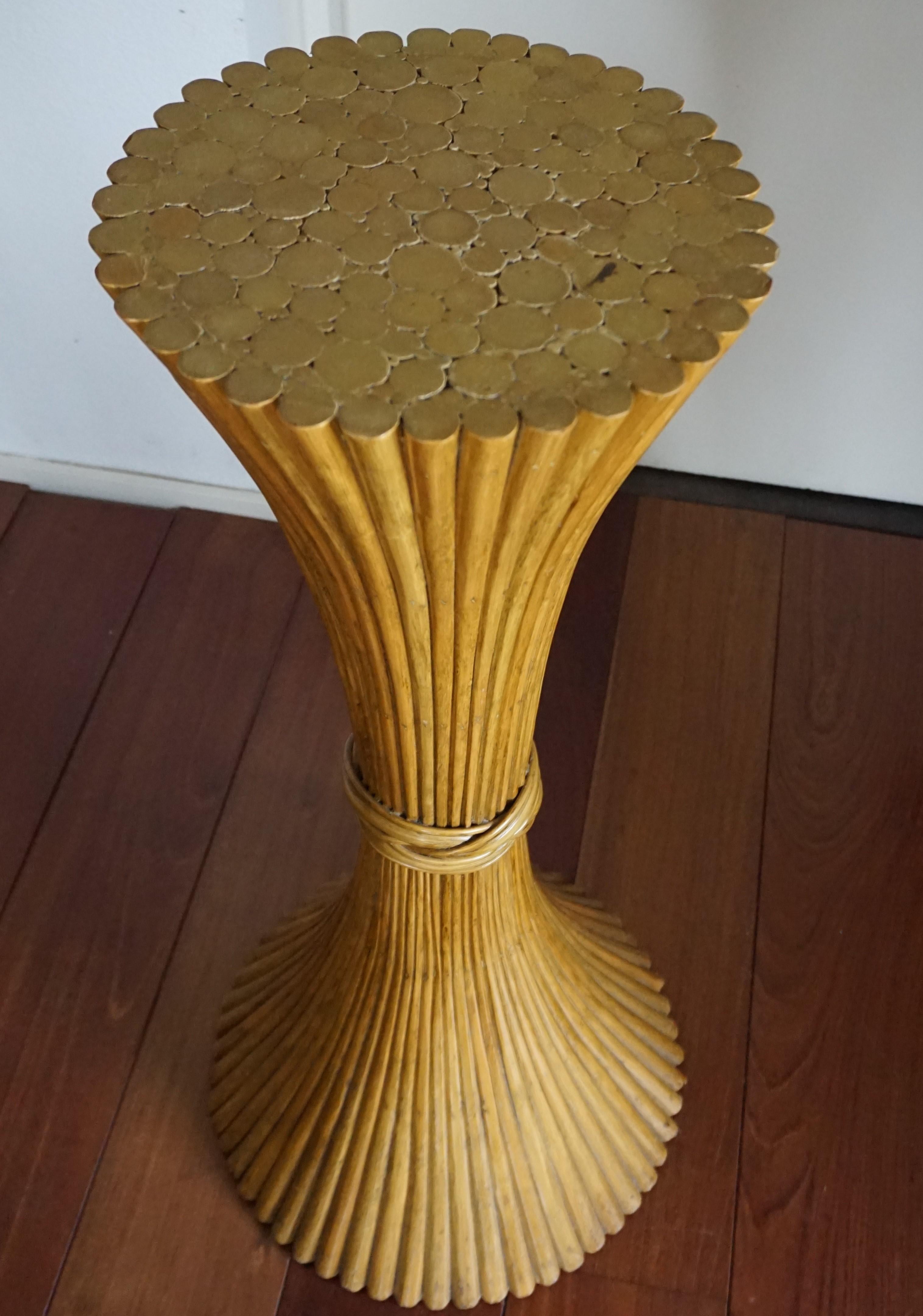 Organically beautiful, stable and practical McGuire stand. 

This decorative and organically stylish stand has been cinched into a sheaf of wheat and it truly is a rare size and shape. The wooden shafts in this hourglass shaped stand are stylishly