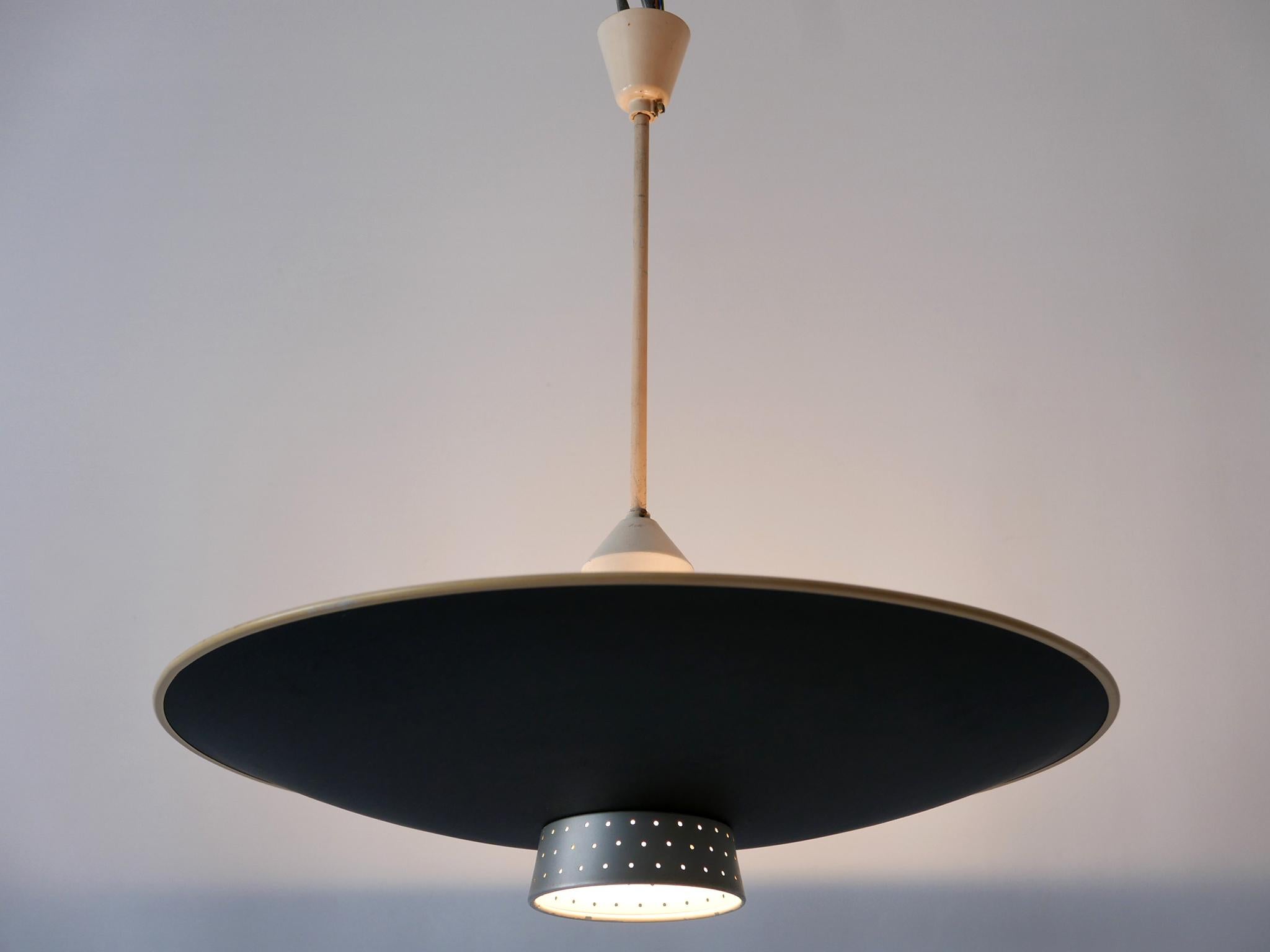 Extremely rare, lovely and highly decorative Mid-Century Modern four-flamed pendant lamp or ceiling light. Designed and manufactured by Philips, Netherlands, 1950s.

Executed in aluminium, the chandelier comes with 4 x E27 / E26 Edison screw fit