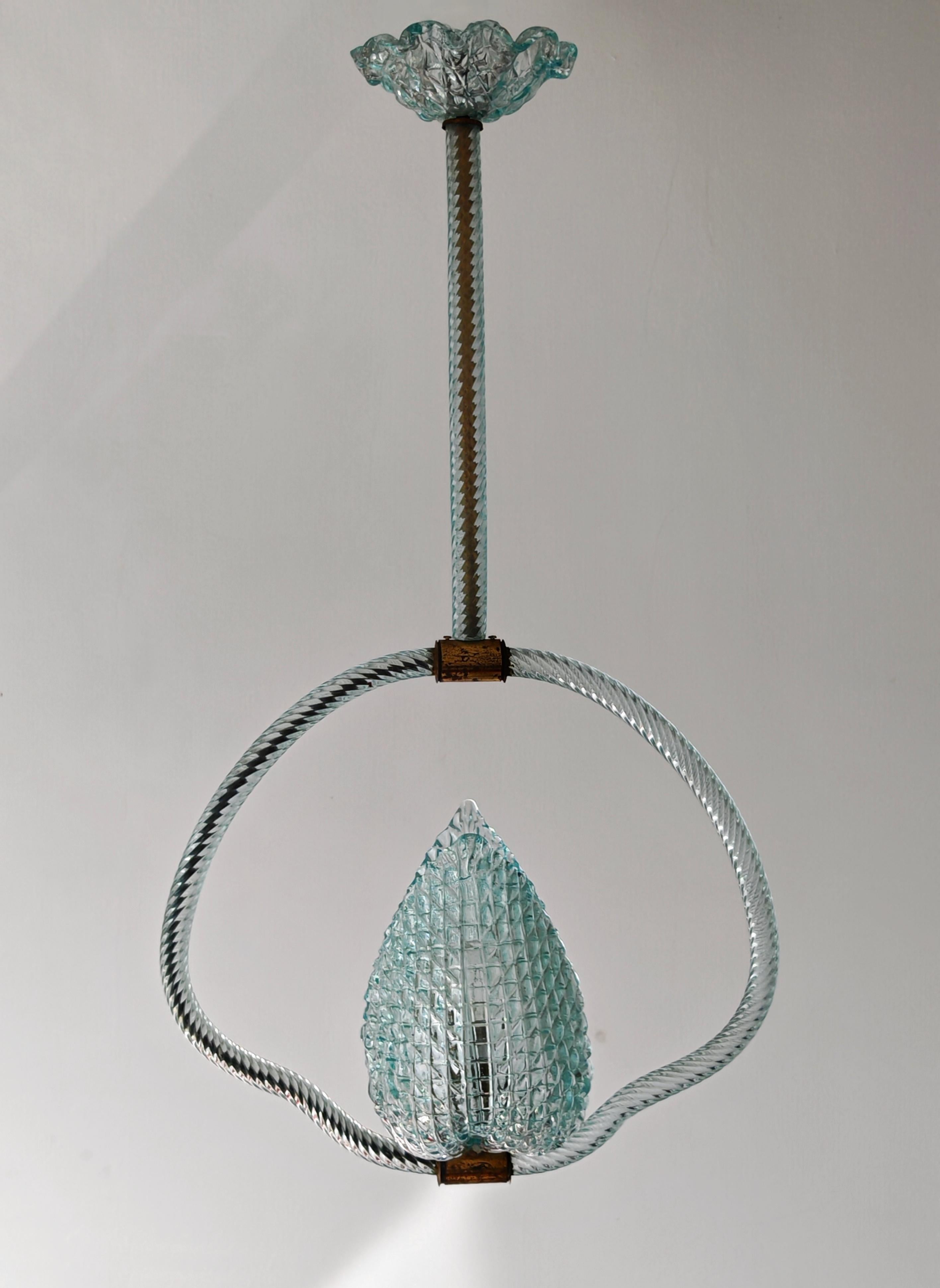 In this listing you will find a very rare Mid Century Modern Blue Jewel glass pendant by Barovier and Toso. It features beautiful glass frame and a flower with the light bulb in its center, in one of the rarest colours in lighting glass