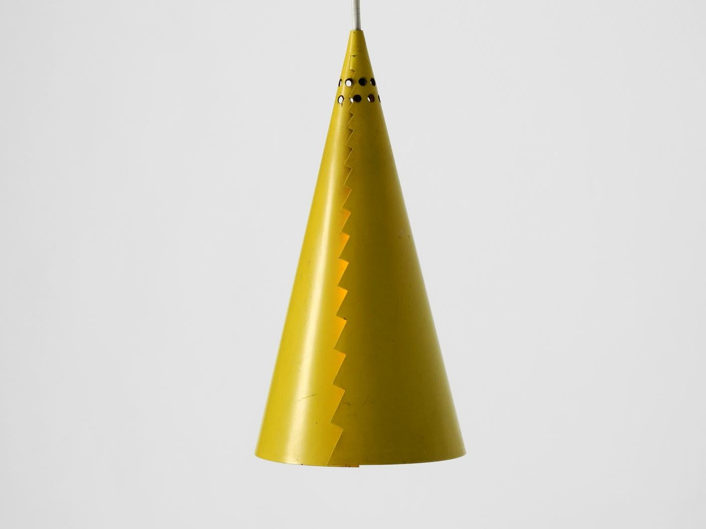 Gorgeous rare large original Mid-Century Modern yellow metal pendant
lamp from Italy. Funny futuristic 1950s cone design in very good original condition.
One original metal E27 socket. Very good vintage condition, no damages to
the lamp, no bumps
