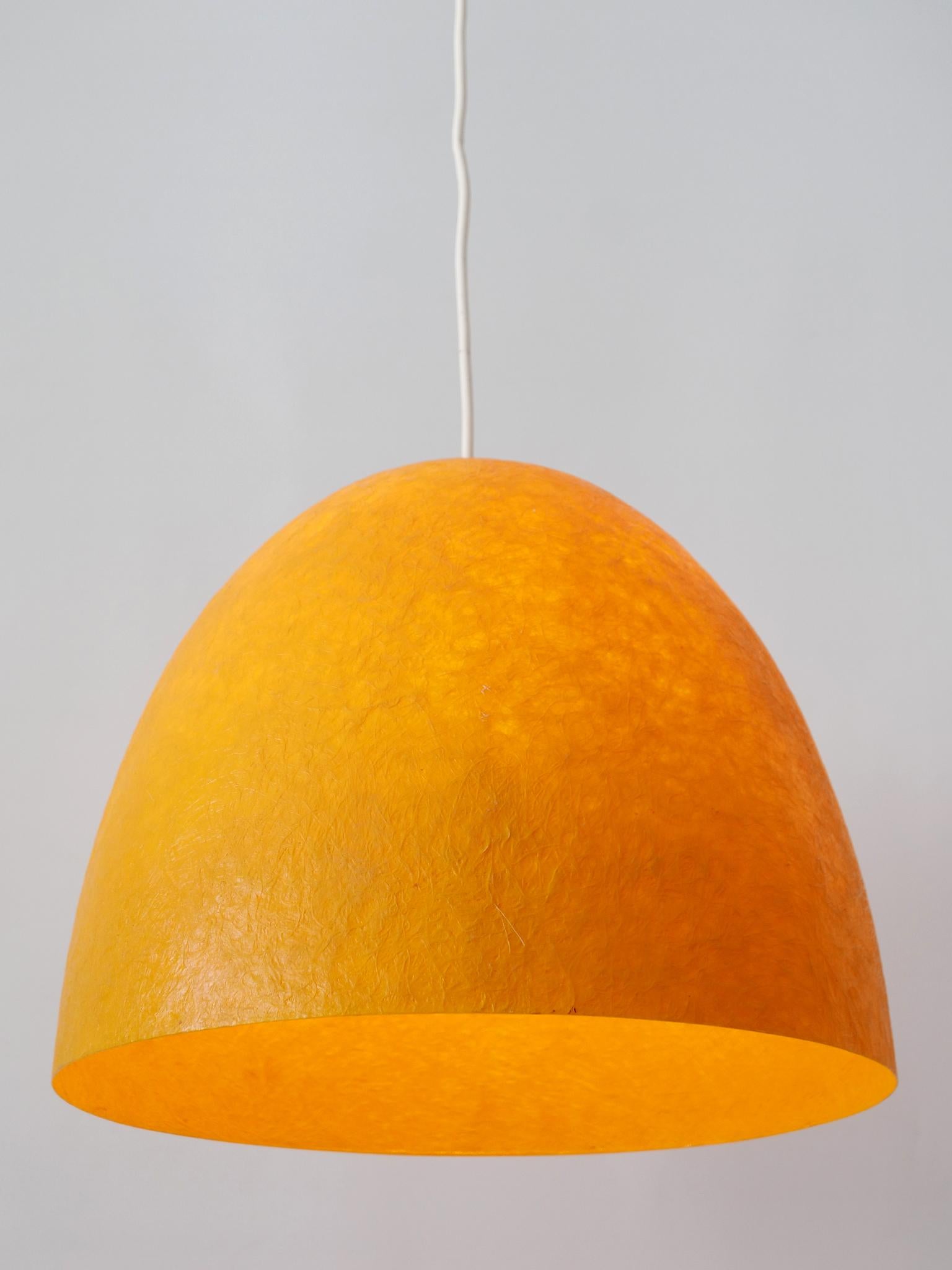 Extremely rare and elegant Mid-Century Modern pendant lamp or hanging light. Designed & manufactured in Germany, 1970s.

Executed in yellow colored fiberglass, the pendant lamp needs 1 x E27 / E26 Edison screw fit bulb. It is wired, in working