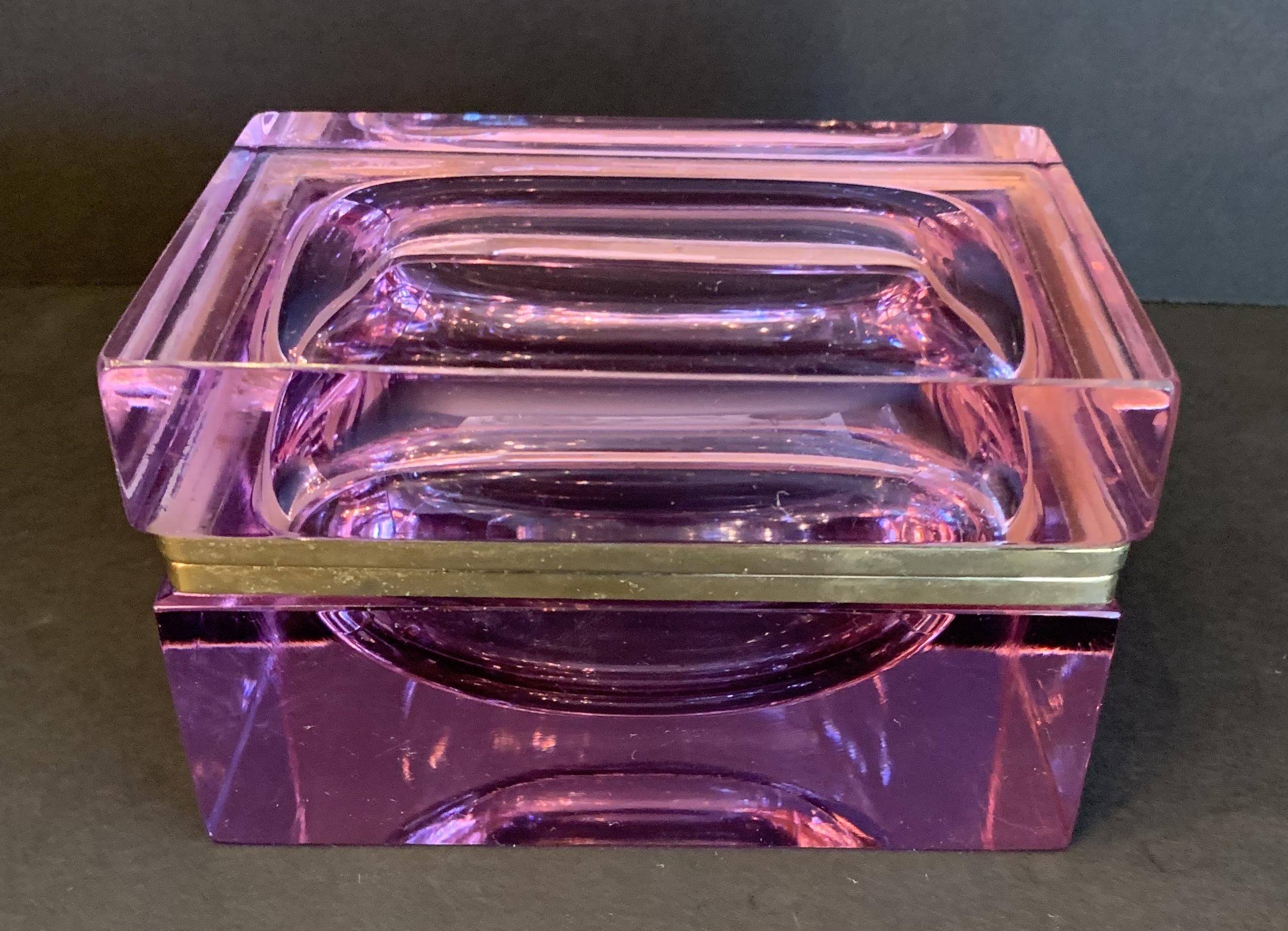 A wonderful and rare Mid-Century Modern French amethyst color crystal or glass ormolu-mounted bronze casket box. Please note there is an almost unnoticeable small piece of glass. Crystal missing under the bronze frame towards the rear left top of