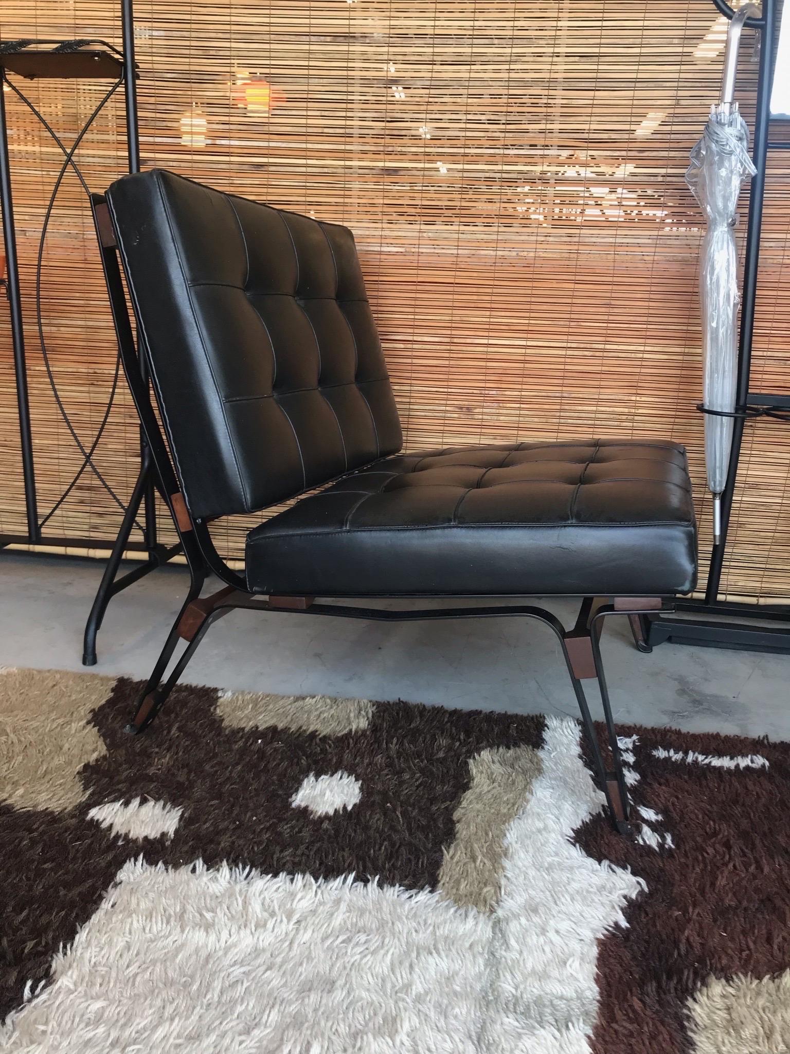 This is a stunning Mid-Century Modern “856” lounge chair designed by Ico Parisi for Cassina, Meda Milan 1957. 
The beautiful design features bent steel frame with solid walnut bracings and original back leather cushions. The original tag is still