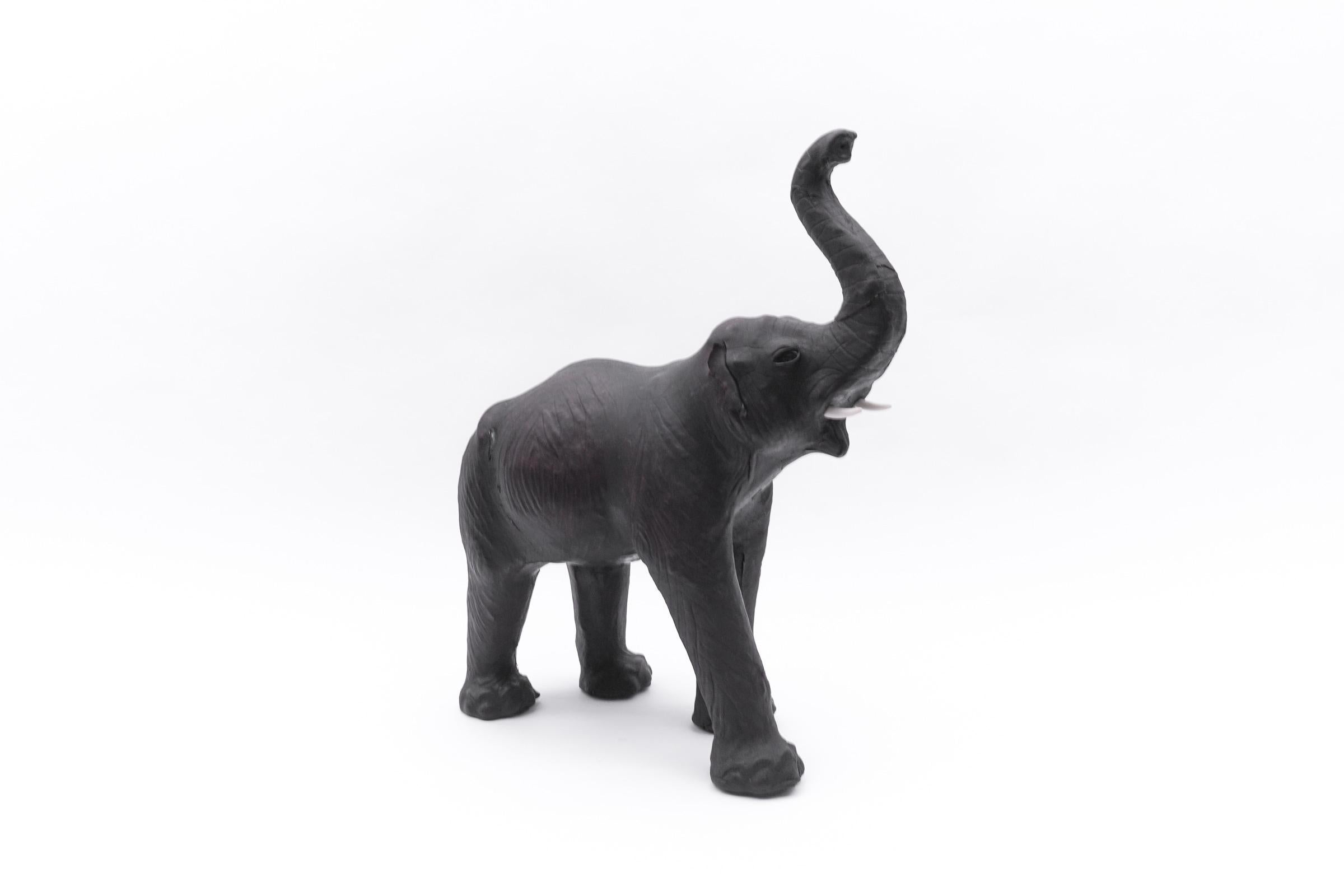 Rare Mid-Century Modern Leather Elephant, 1960s

The proportions are wonderfully genuine, the horse amazingly high and the eye-catcher par excellence.

One ear is partially missing, slight cracks here and there, see pictures.
