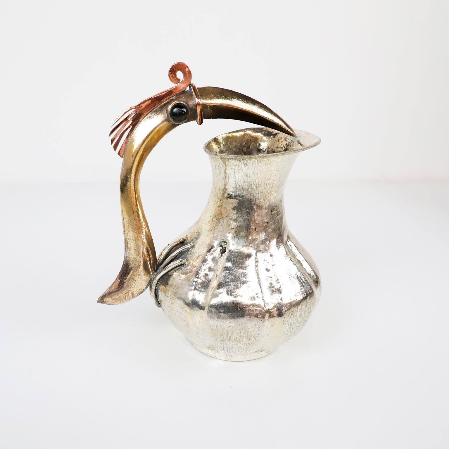 Circa 1960. We offer this Mid-Century Modern Mexican pitcher sporting an amazing handle in a bird motif by Los Castillo Taxco México. The pitcher Marked Los Castillo Taxco Mexico, in excellent condition, but adds to the patina of the piece. This is
