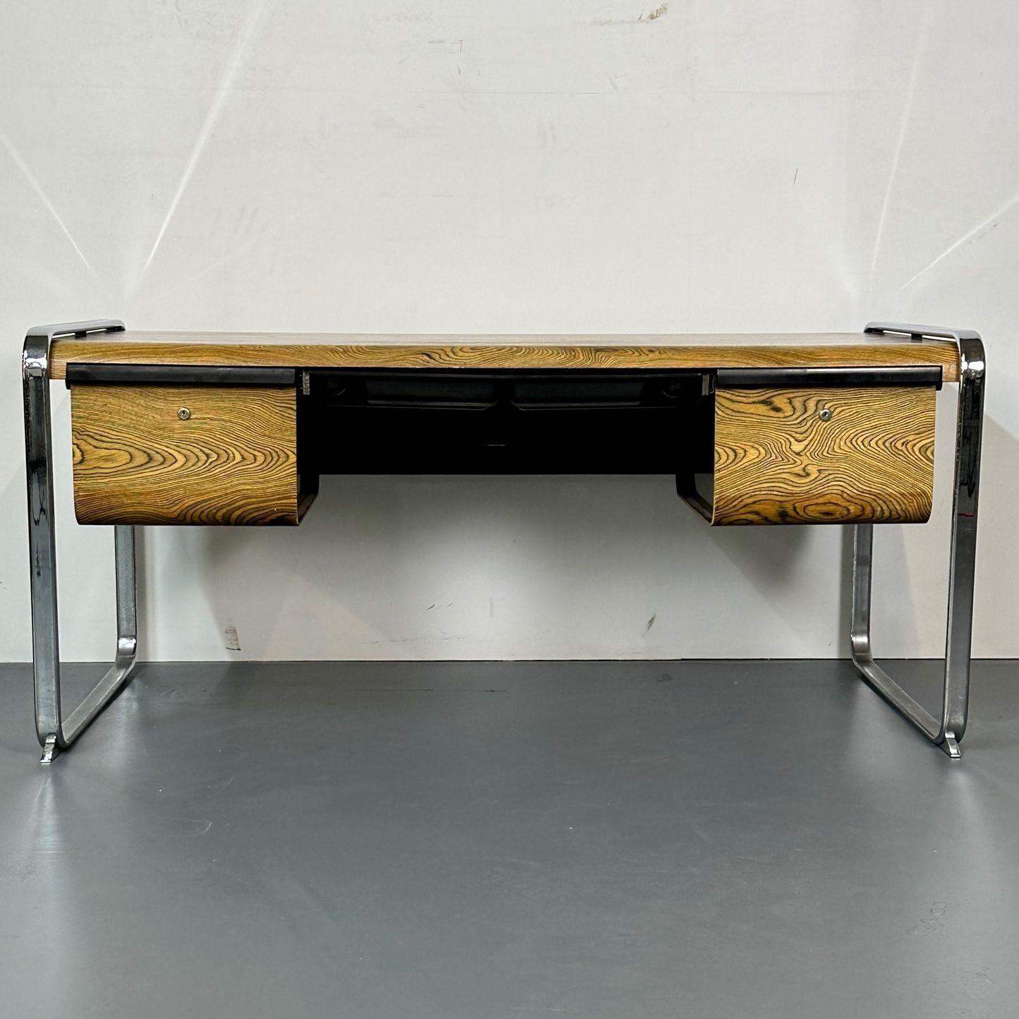 Rare Mid Century Modern Peter Protzman for Herman Miller Zebrawood / Chrome Desk
 
This iconic desk, designed by Peter Protzman for Herman Miller, was only manufactured for two years (1970-1971) making it a rare, limited production item. The smooth,