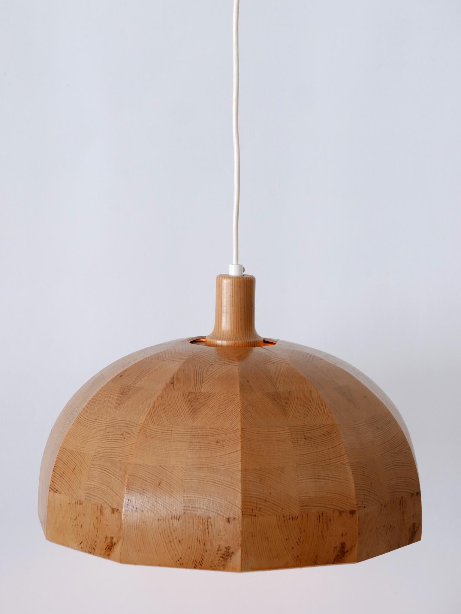 Extremely rare, elegant highly decorative Mid-Century Modern pendant lamp or hanging light. Designed & manufactured in Sweden, 1960s.

Executed in pine wood, the lamp needs 1 x E27 / E26 Edison screw fit bulb, is rewired, in working condition and