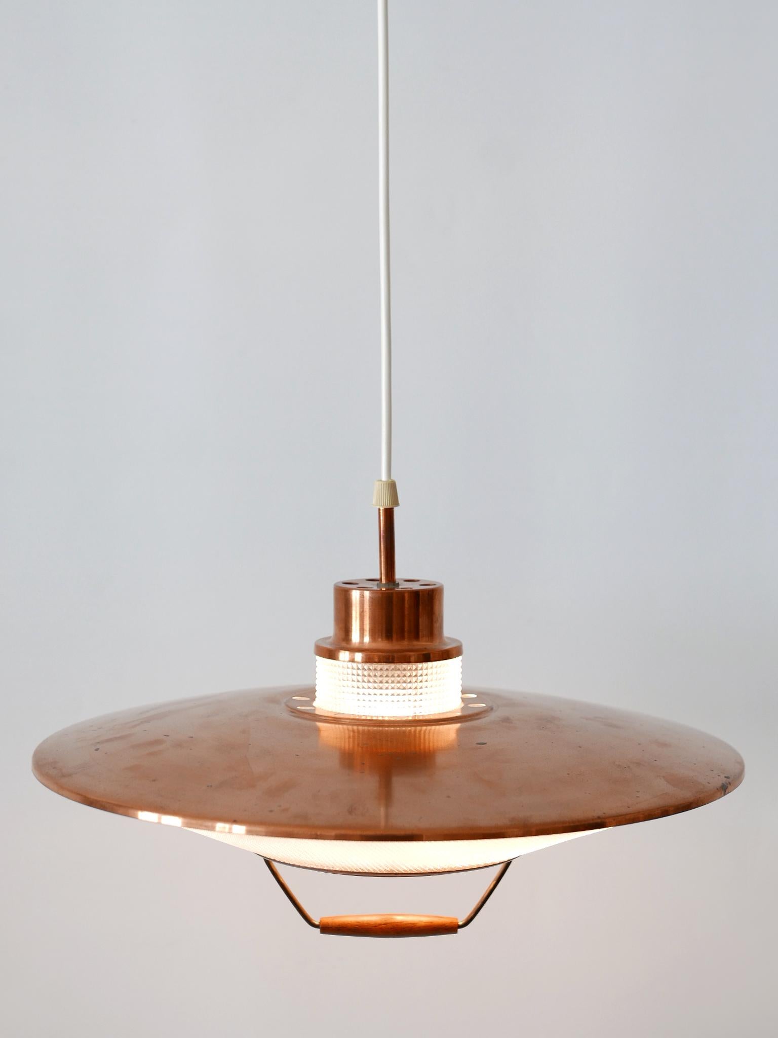 Rare and highly decorative Mid-Century Modern pendant lamp or hanging light. Designed & manufactured in 1960s in Scandinavia.

Executed in copper and acrylic, the lamp needs 1 x E27 / E26 Edison screw fit bulb, is rewired, in working condition and