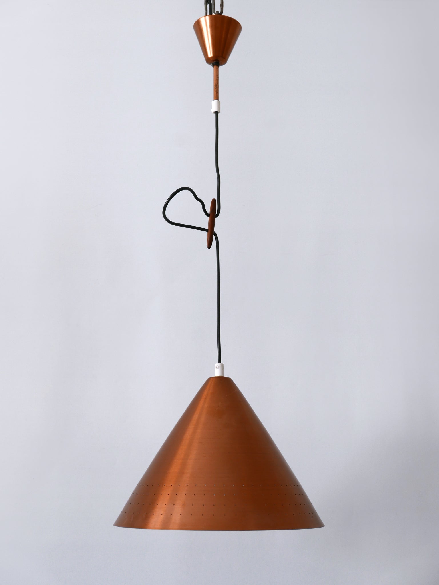 Rare, elegant and highly decorative Mid-Century Modern perforated copper pendant lamp or hanging light. Designed and manufactured probably in Scandinavia in 1960s.

Executed in perforated copper sheet, the pendant lamp needs 1 x E27 / E26 Edison