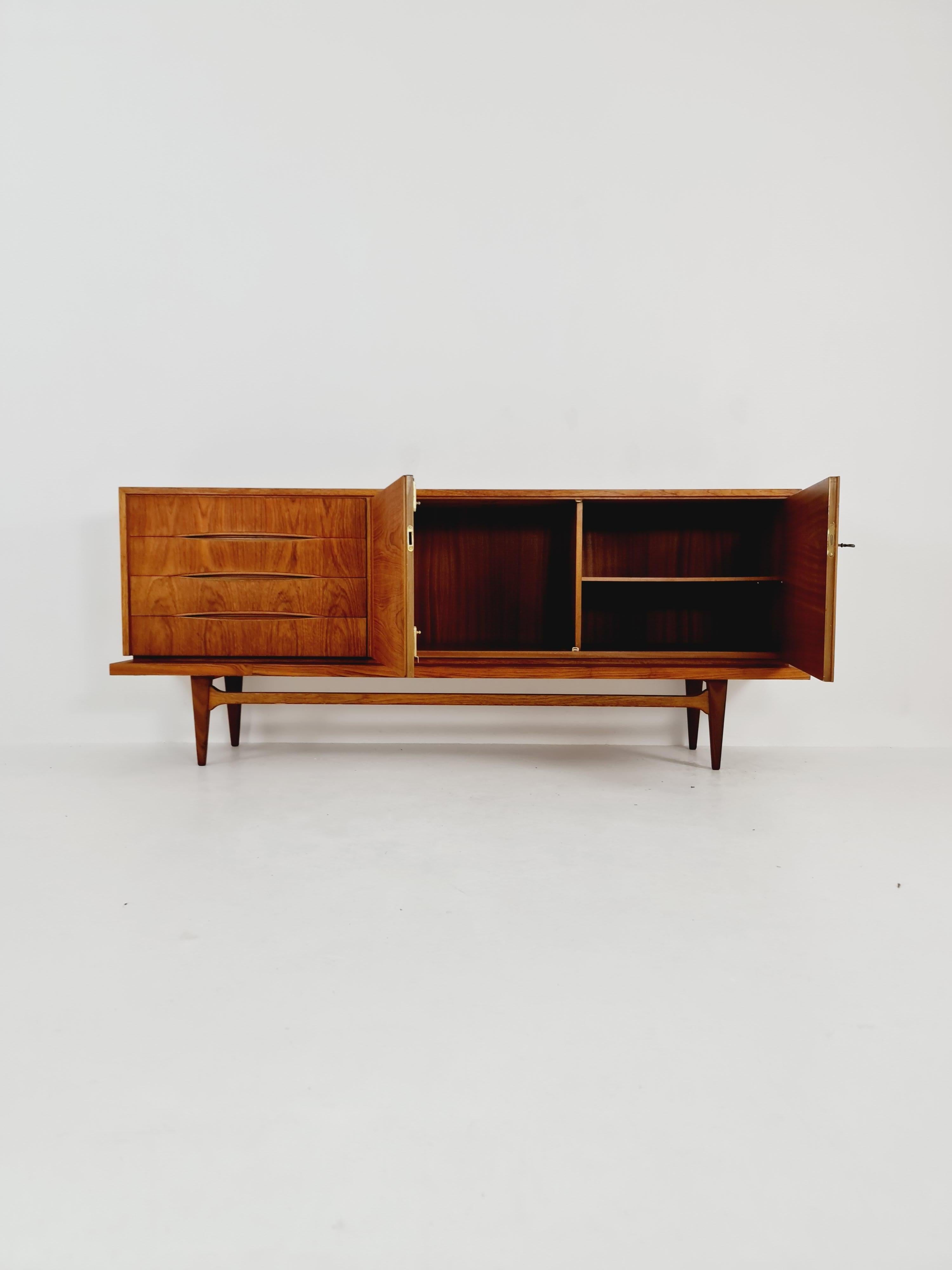 Rare Mid Century Modern Danish teak sideboard, 1960s 

Design year: 1960s

Dimensions: 
45 D x 205 W x 83 H cm

It is in good vintage condition, however, as with all vintage items some minor wear marks should be expected.

Please inquiry for prices