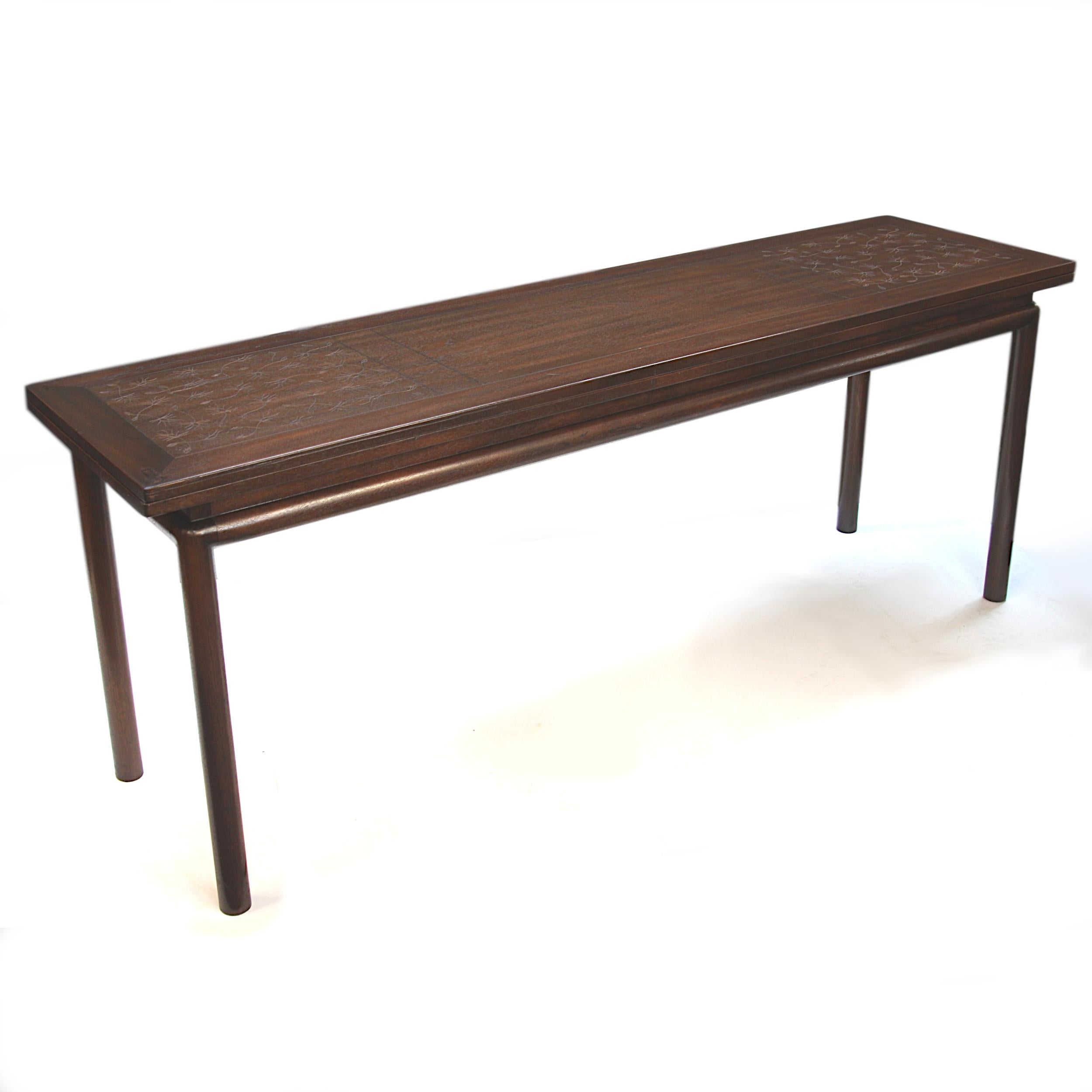 This is a rare 1950s Asian-inspired console table by Kittinger Furnitture Co. of Buffalo, NY. Table features an incised 