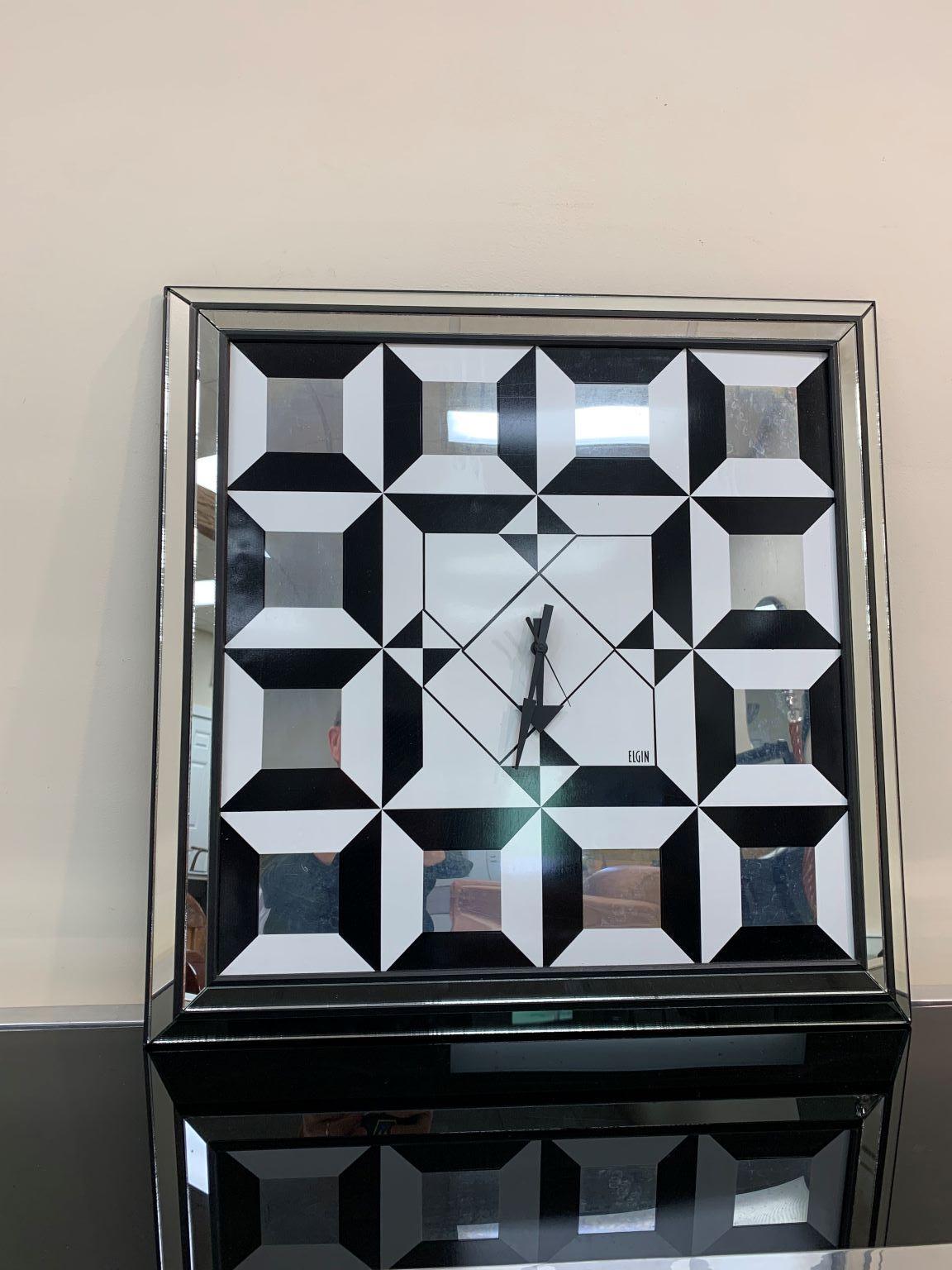 A fabulous, optical illusion art mirror, with a diamond design, in the style of Verner Panton, circa 1970s. In good condition. Rare example of mirror with clock. Clock is in working condition however uncertain if it is able to maintain correct time.