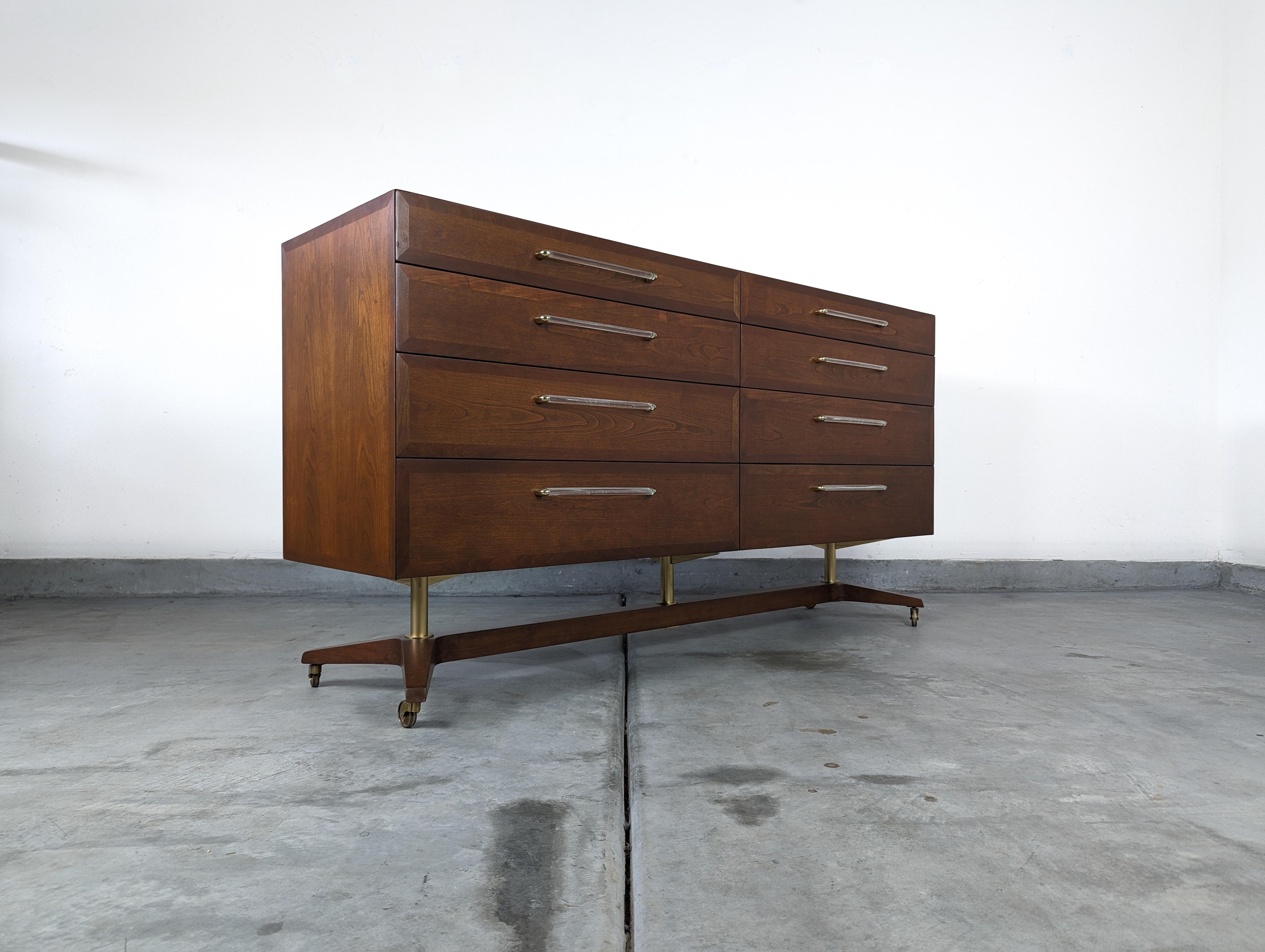 Behold an exceptional treasure of design history, a vintage mid-century modern walnut dresser crafted by the iconic Edward Wormley for Dunbar, circa 1950s. This exquisite piece is an extraordinary find, seldom seen on the market and coveted by