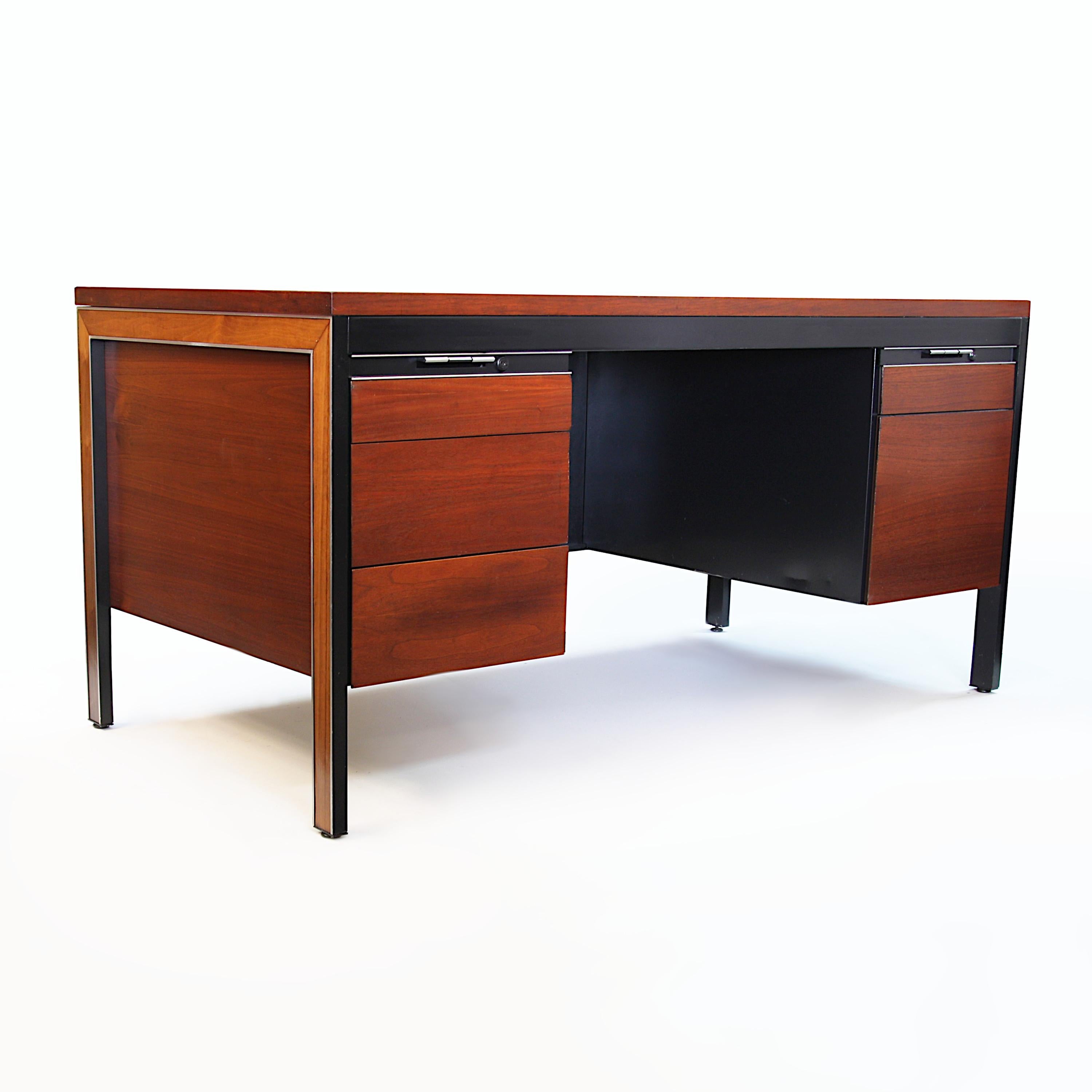 This ultra-rare and ultra-cool desk features a black steel frame, walnut veneer cabinet and brushed-aluminum legs with rosewood inlay. The contrasting woods, aluminum accents and minimalist, mid-century lines, make this desk is the epitome of 70's