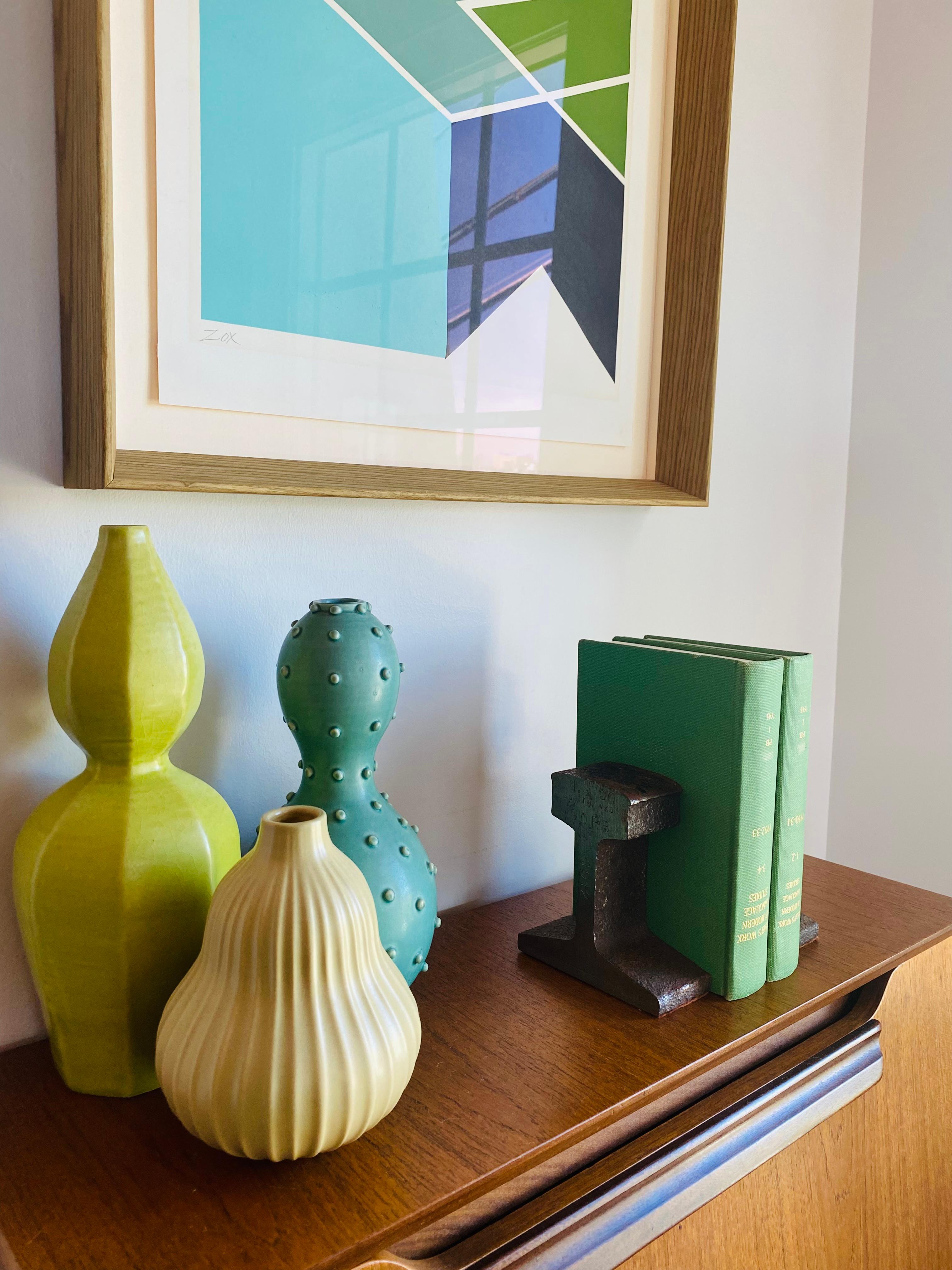 Vintage heavy train railroad tie track bookends in the style of Ward Bennett.  Unique features for this pieces as beams date to 1912.  Felt in bases, raw metal finish around with slick sides.  Modernist pieces with elevated style for Mid Century and