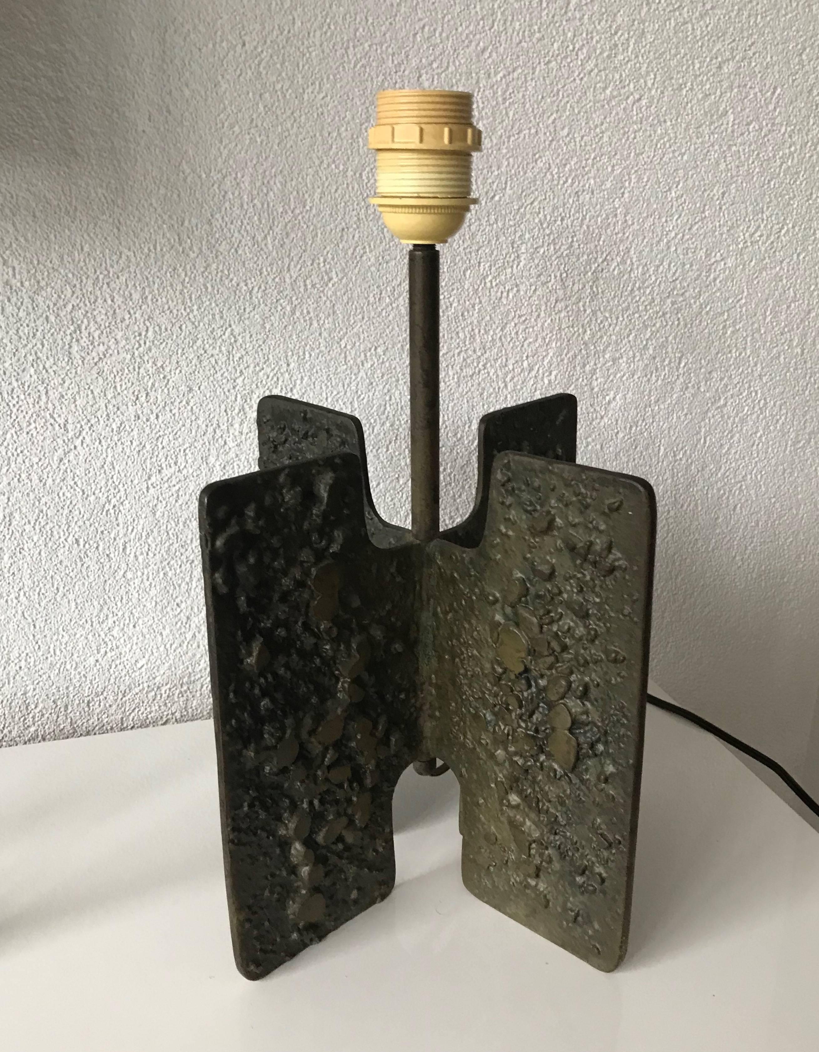 Unique and decorative work of midcentury lighting art.

Unfortunately we don't know the artist who created this table lamp. So in order to find out about the deeper meaning of this work of lighting art we will have to try and analyze the piece