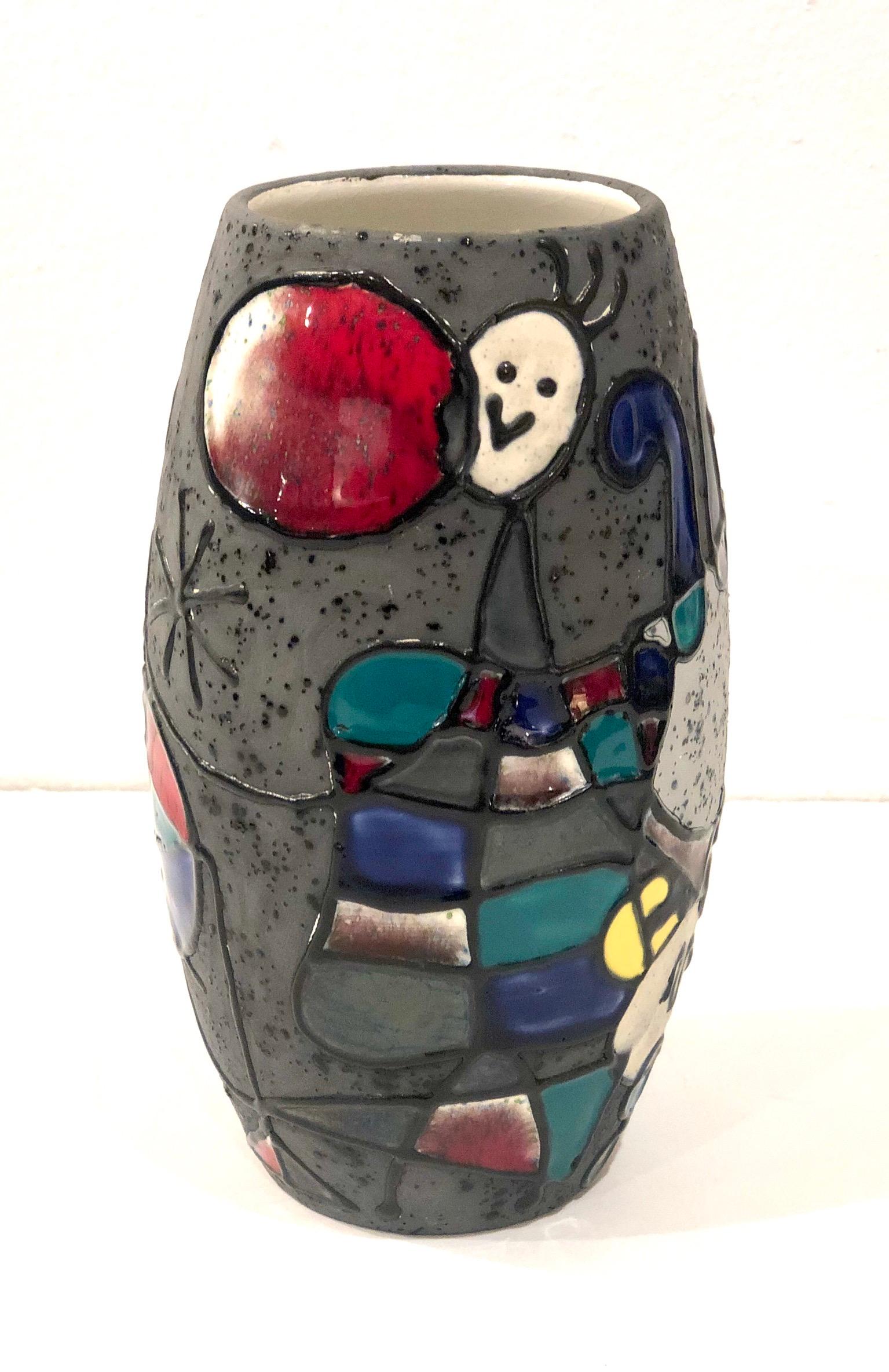Beautiful hand painted ceramic vase after Joan Miró, Made in Italy circa 1950s , glazed in white inside with Joan Miro graphics, excellent condition. Signed at the bottom in gold Made in Italy by Le Felie.