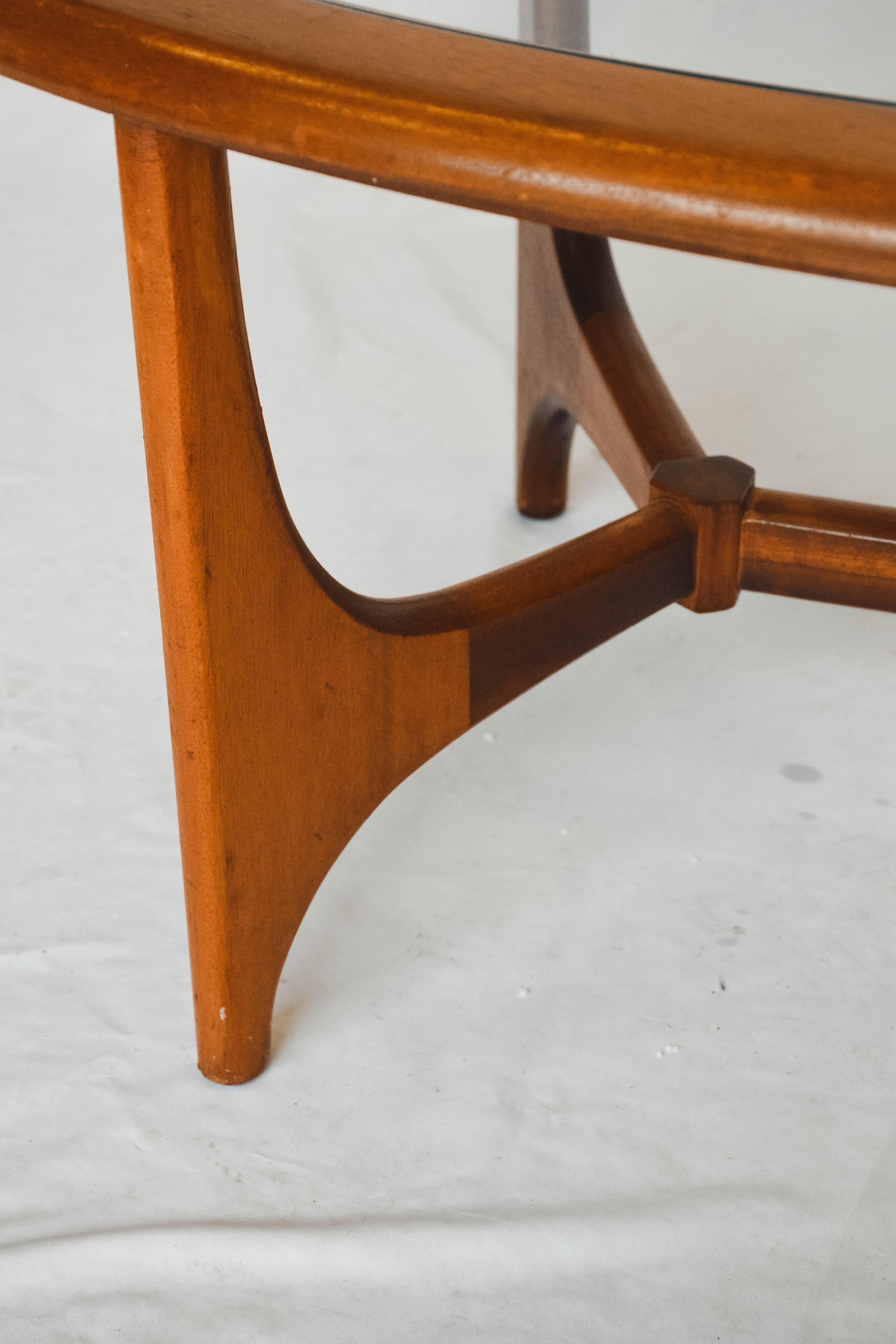 Beautiful and rare coffee table designed by Alf Svensson and produced by Bra Bohag from Sweden. The table consists of a teak wooden frame and a glass top.