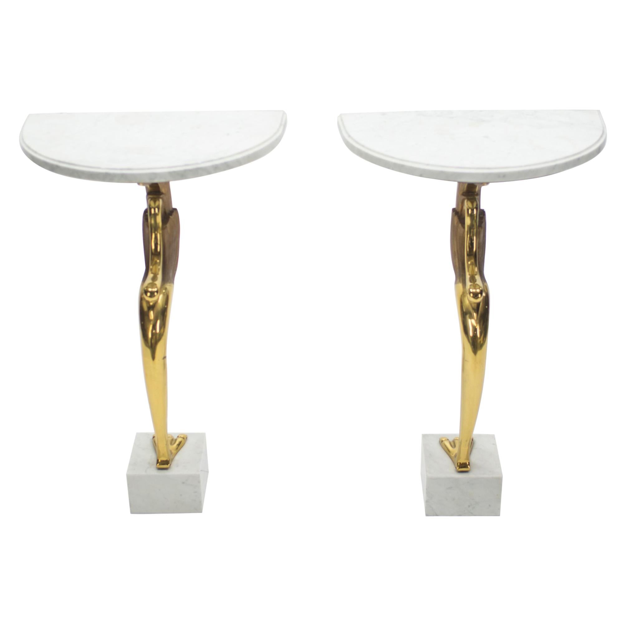 This pair of Mid-Century Modern console tables, made from bright, solid brass and white marble, were designed by Robert Thibier, for his own apartment and showroom located on Rue du Faubourg Saint Honoré in Paris. As you can see from the