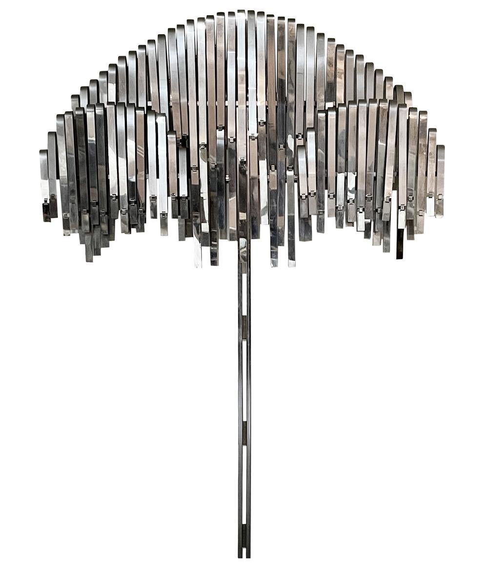 A large and impressive abstract wall sculpture by Curtis Jere circa 1977. It consists of many chrome elements in a tree or umbrella form. Uncommonly seen sculpture. Signed and dated.