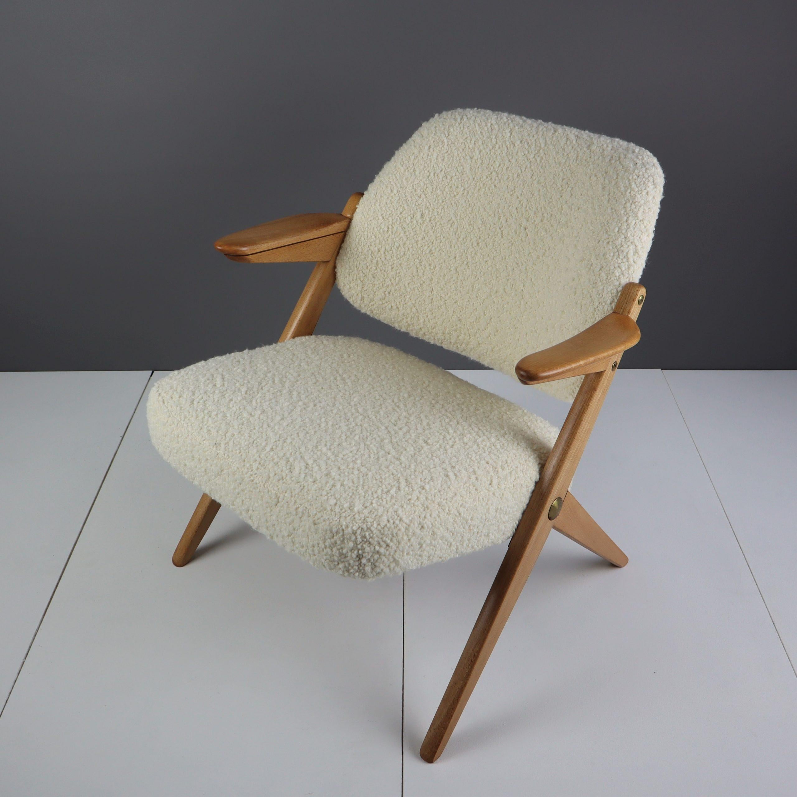 A rare Bengt Ruda midcentury beech armchair reupholstered with an Italian off-white bouclé fabric from Designers Guild’s Lana collection.

We bought this chair in July 2022 at an auction in Sundsvall, Sweden. We have a penchant for midcentury