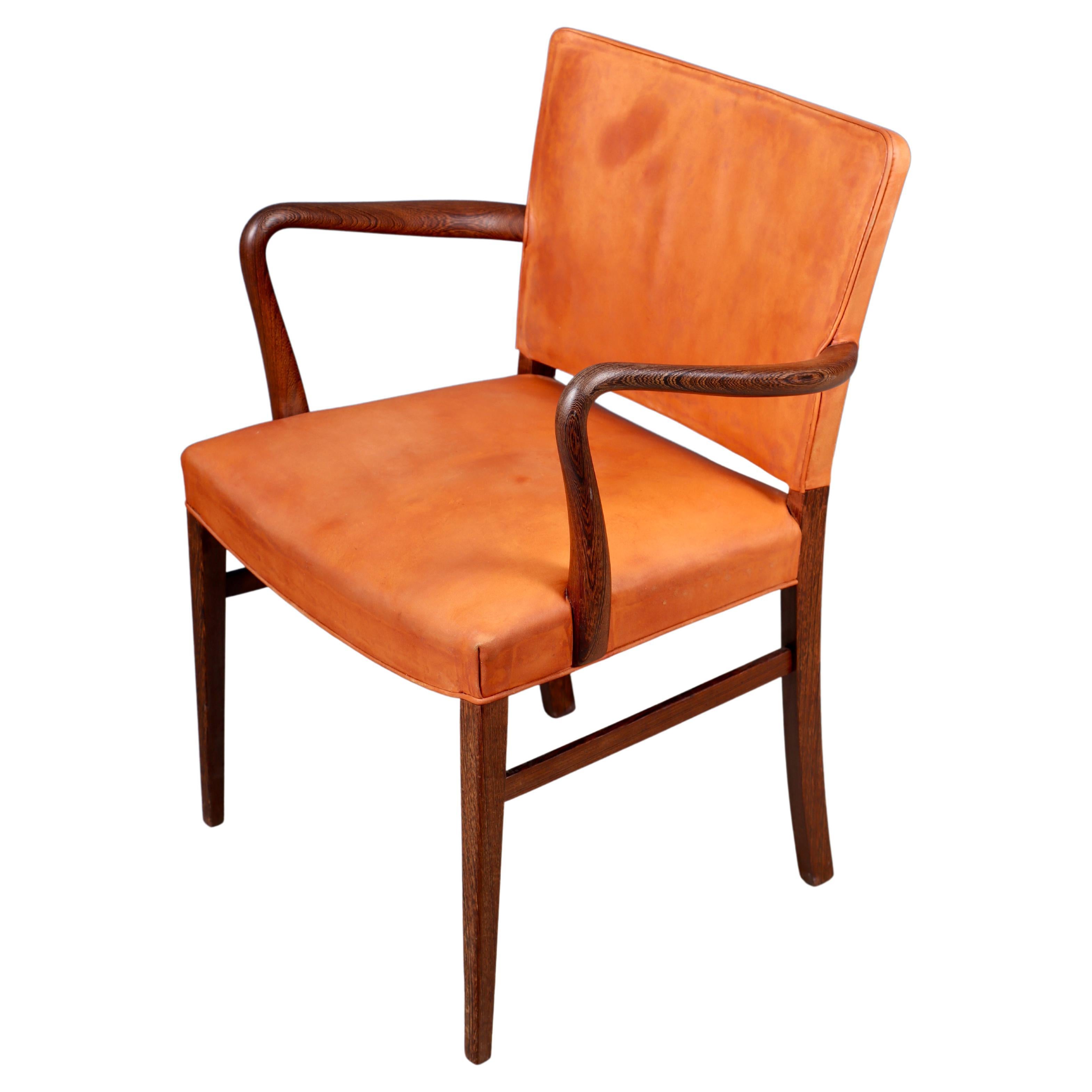 Danish armchair in patinated leather and wenge. Designed and made in Denmark, great original condition.