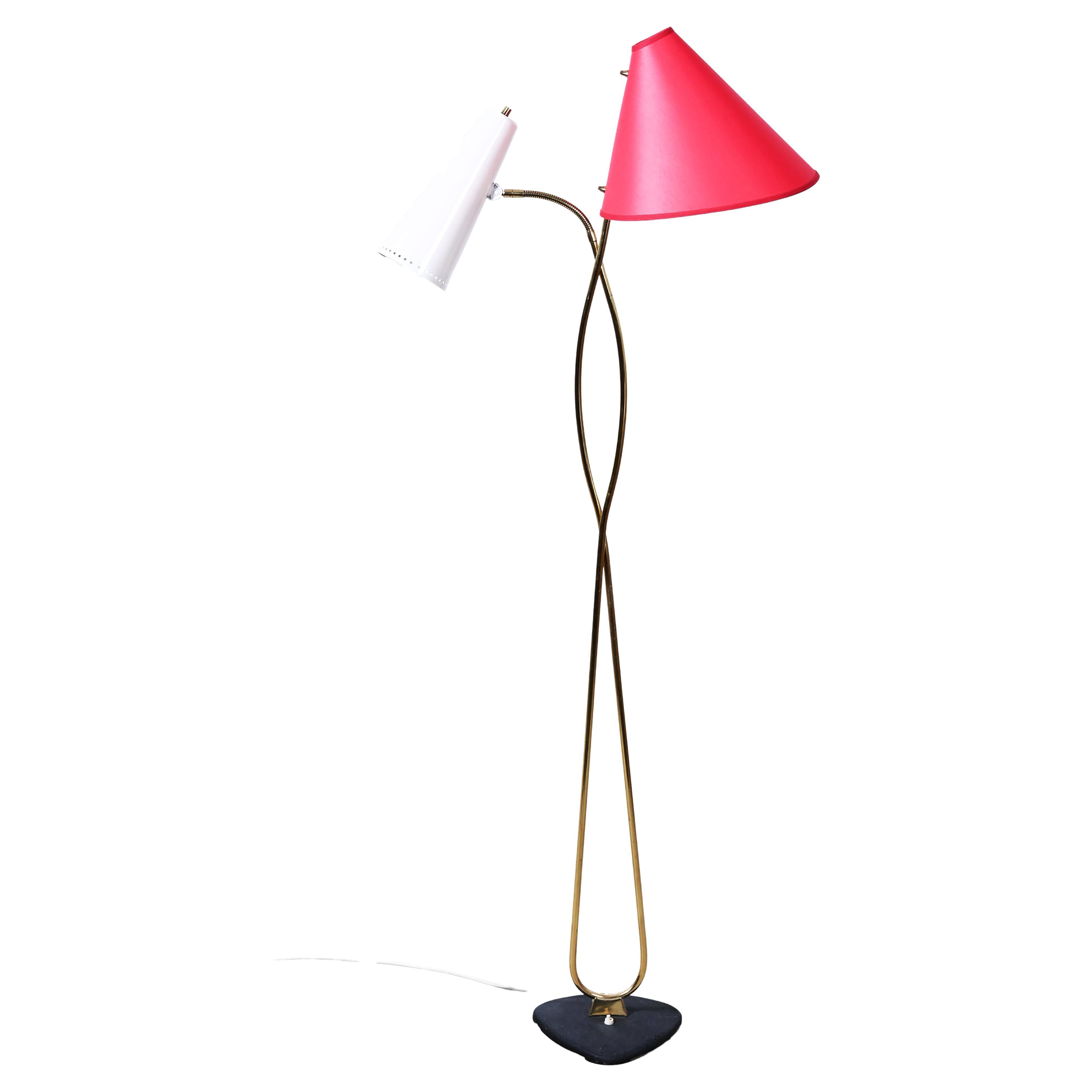 Very rare floor lamp by Rupert Nikoll from the late 1950. Brass frame of a iron base with two shades one with a gooseneck fitted each with an E27 socket, the red shade is new, some use marks.