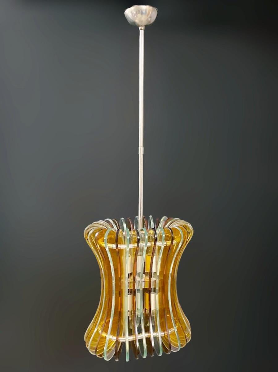 Rare vintage Italian midcentury chandelier with curved beveled glasses mounted on chrome frame / Made in Italy by Veca, circa 1960s
Width: 10.5 inches / height: 11.5 inches / depth: 8 inches
4 lights / E12 or E14 type / max 40W each
1 available in