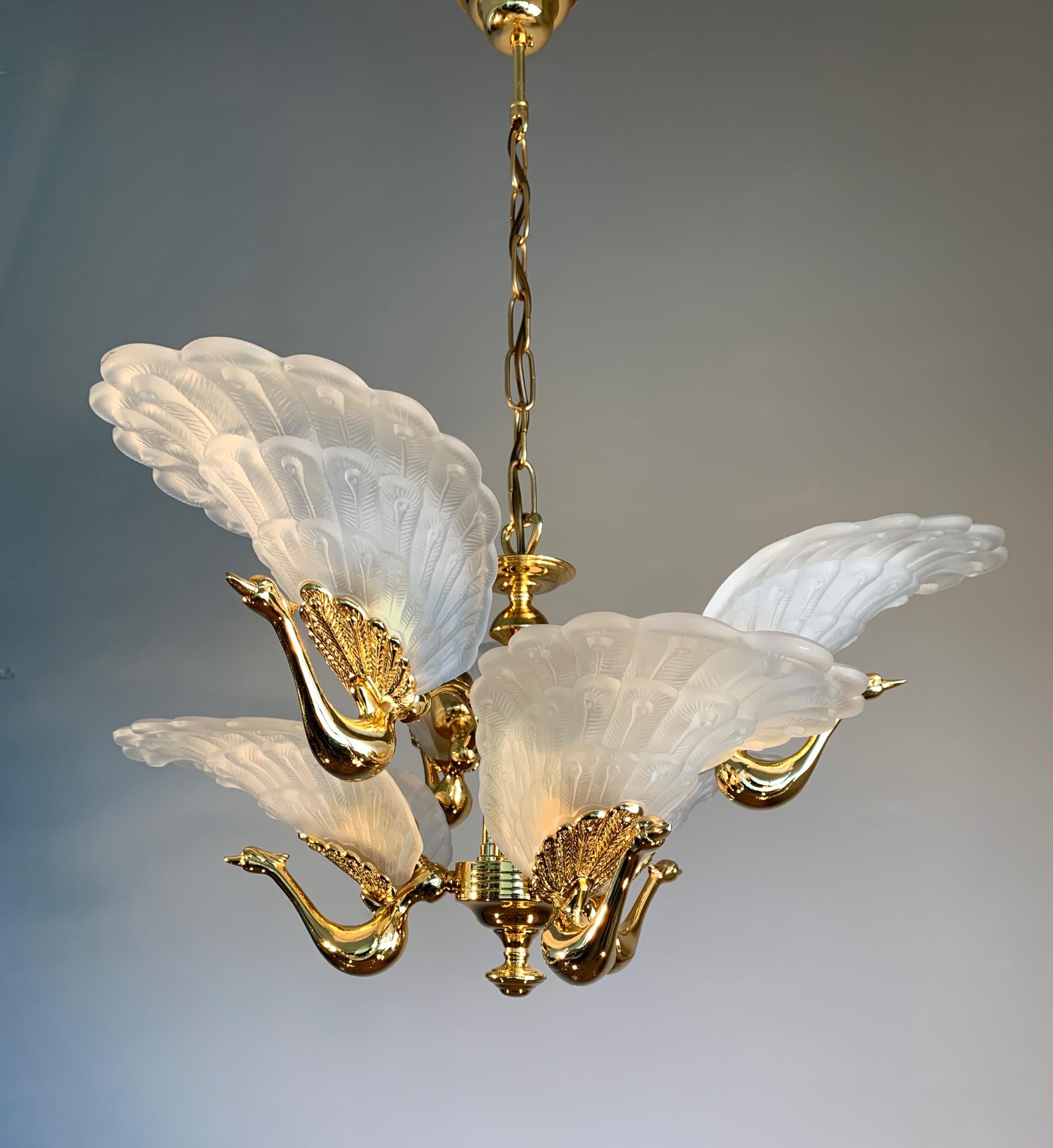 Sculptural and highly decorative two tiers six light fixture.

The peacock has, since ancient times, been regarded as an animal with many positive and even healing characteristics. And that has inspired many artist and designers through all times