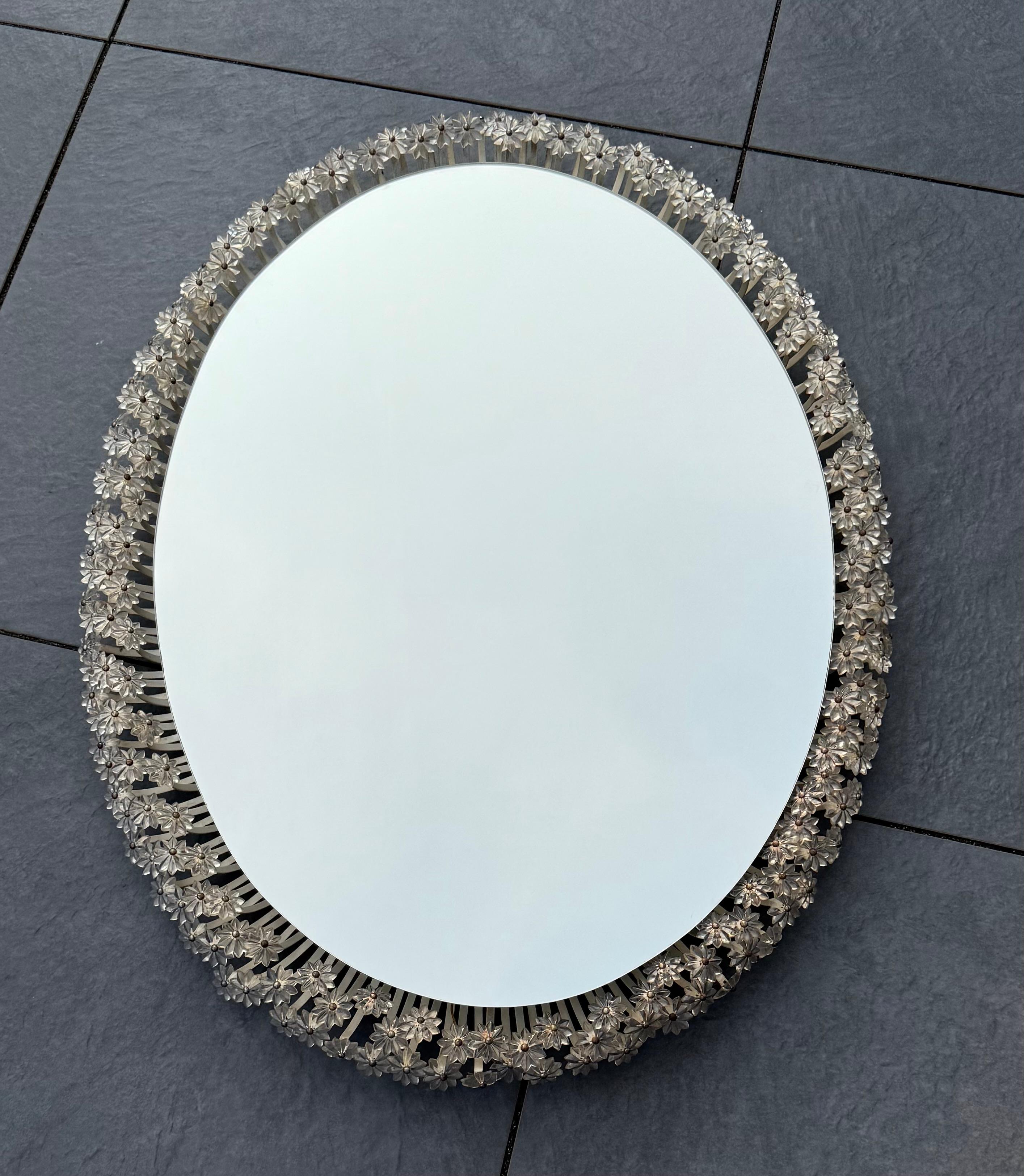Stylish Mid-Century Modern vanity / make up hallway mirror for wall mounting, 1950s.

An exceptional and highly collectible piece by famed Austrian designer Emil Stejnar, this illuminated mirror from the 1950s is a radiant example of mid-century