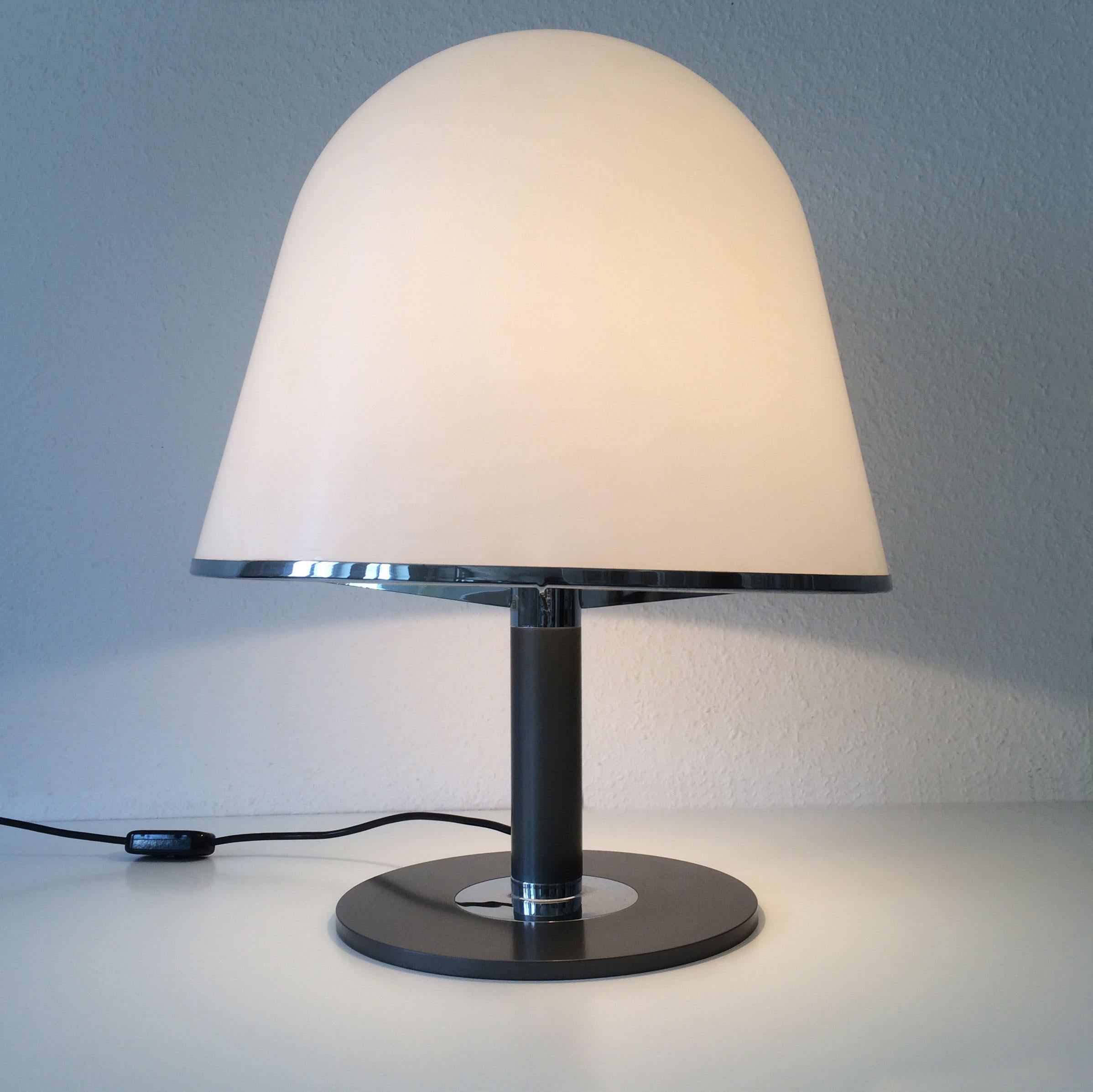 Rare and lovely Mid-Century Modern Kuala table lamp. Designed by Franco Bresciani, 1976. Manufactured by iGuzzini, Italy, 1970s.

This elegant table lamp is executed in metal and plexiglass and with 1 x E27 screw fit socket. 
It is with original