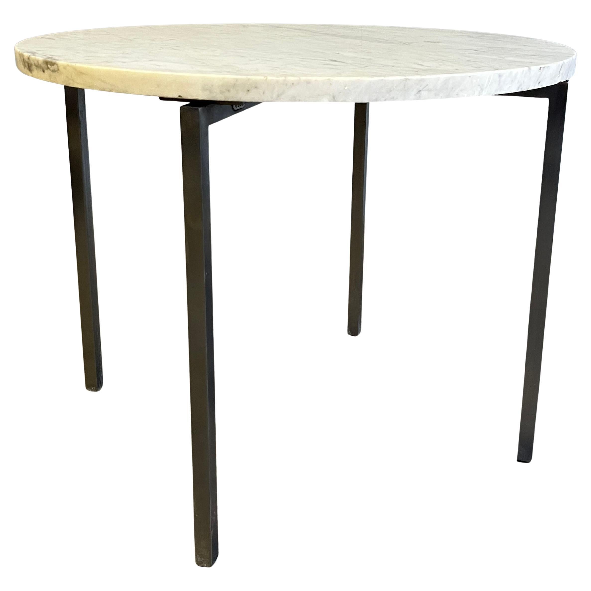 Nice round table with brushed chromed or nickel base. Rarely seen round table with great dimensions that could also be used as a small coffee table. 

Marble is original and  shows signs of use with some dings to the edges. Marble can easily be