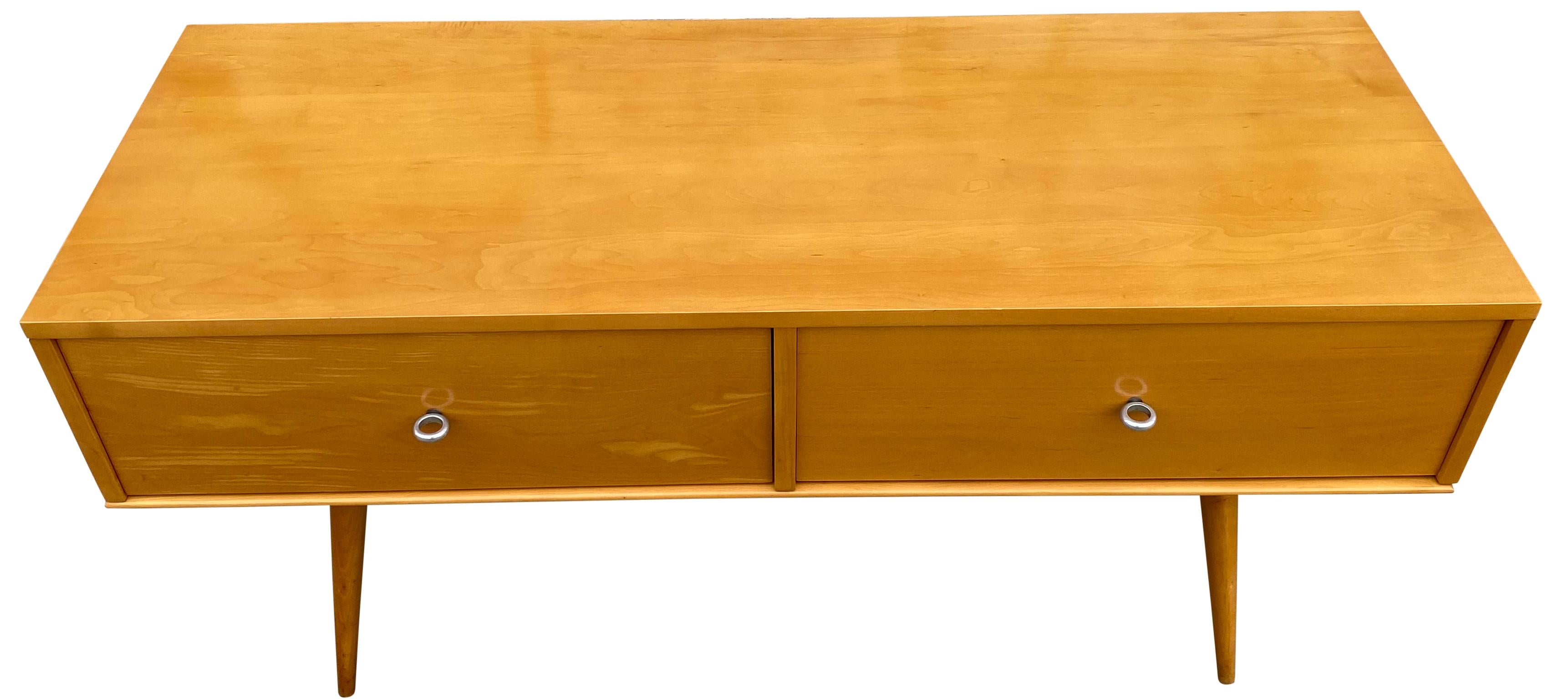 Unique rare custom midcentury low dresser small credenza by Paul McCobb circa 1950 Planner Group with two low drawers - solid maple construction has a raw Blonde lacquered finish. All original aluminum ring pulls. Sits on maple table base with 4