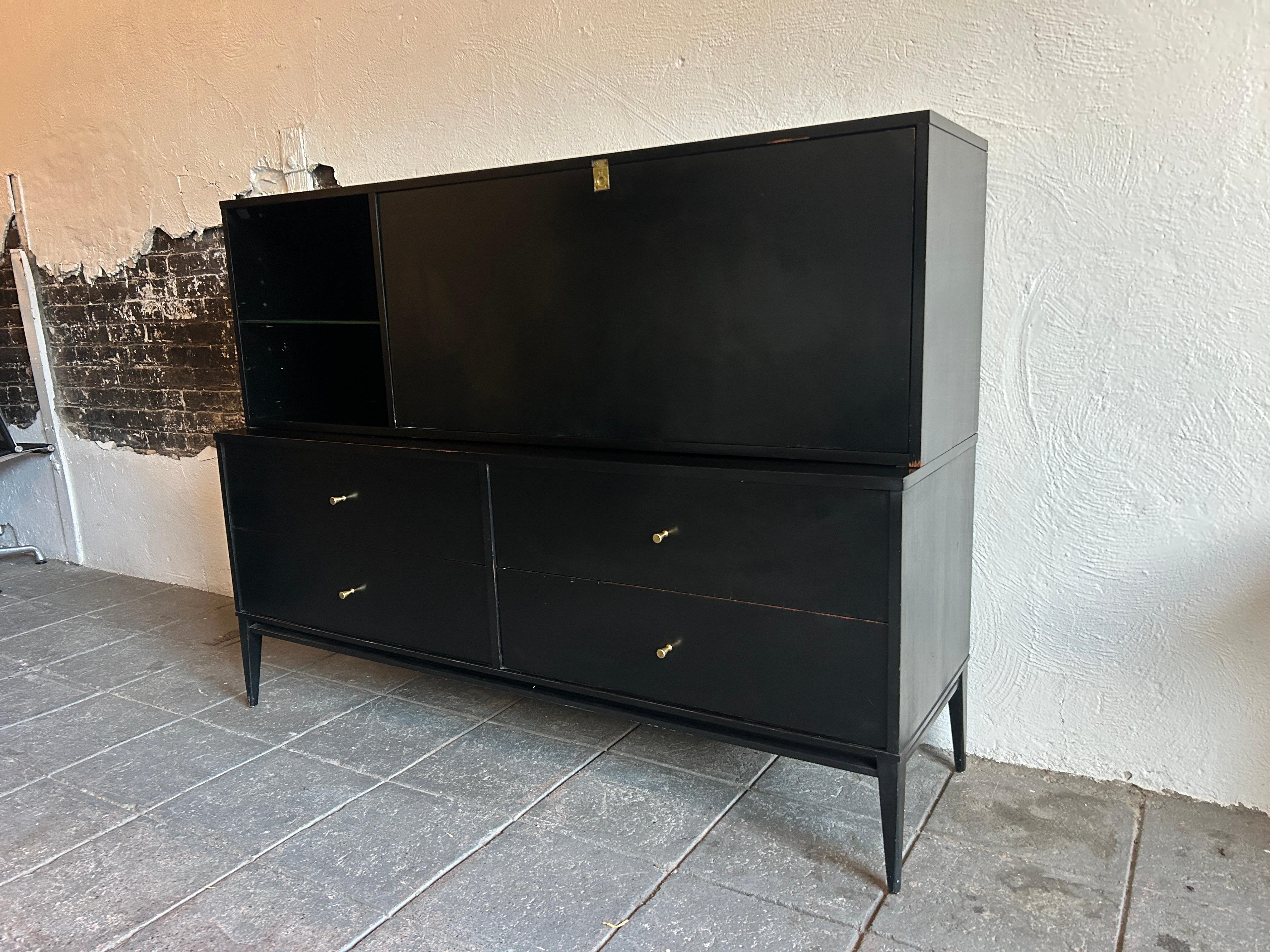 Beautiful Paul McCobb planner group #1562 drop lid desk with Rare organizer inside and adjustable glass shelf in original Black Lacquer finish brass cone pulls all solid maple. Flip down front door is desk height 28” with white lacquered top desk