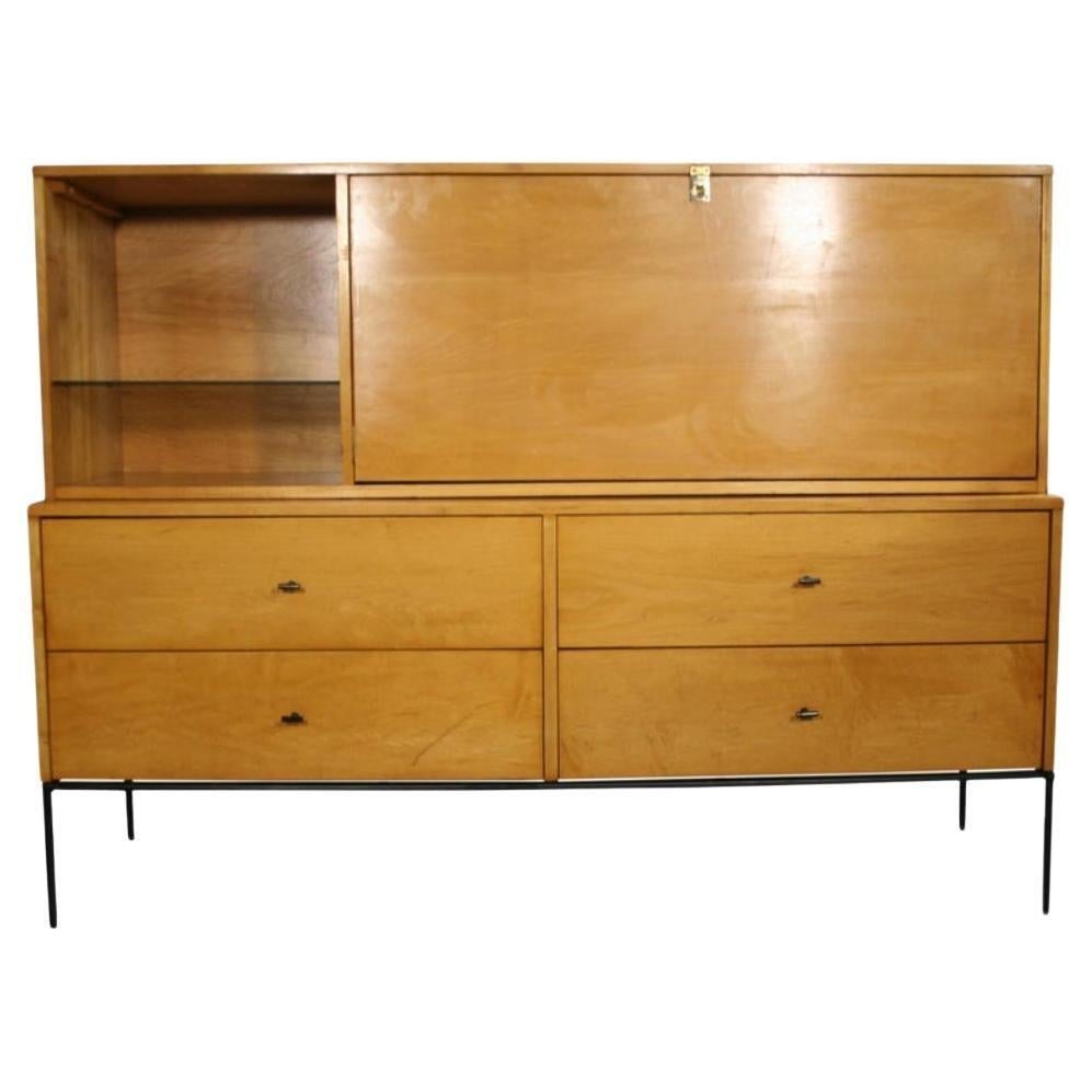 Beautiful Paul McCobb planner group #1562 drop lid desk with Rare organizer inside and adjustable glass shelf blonde maple finish T-pulls all solid maple. Flip down front door is desk height 28” high with white laminate top surface. This desk is in