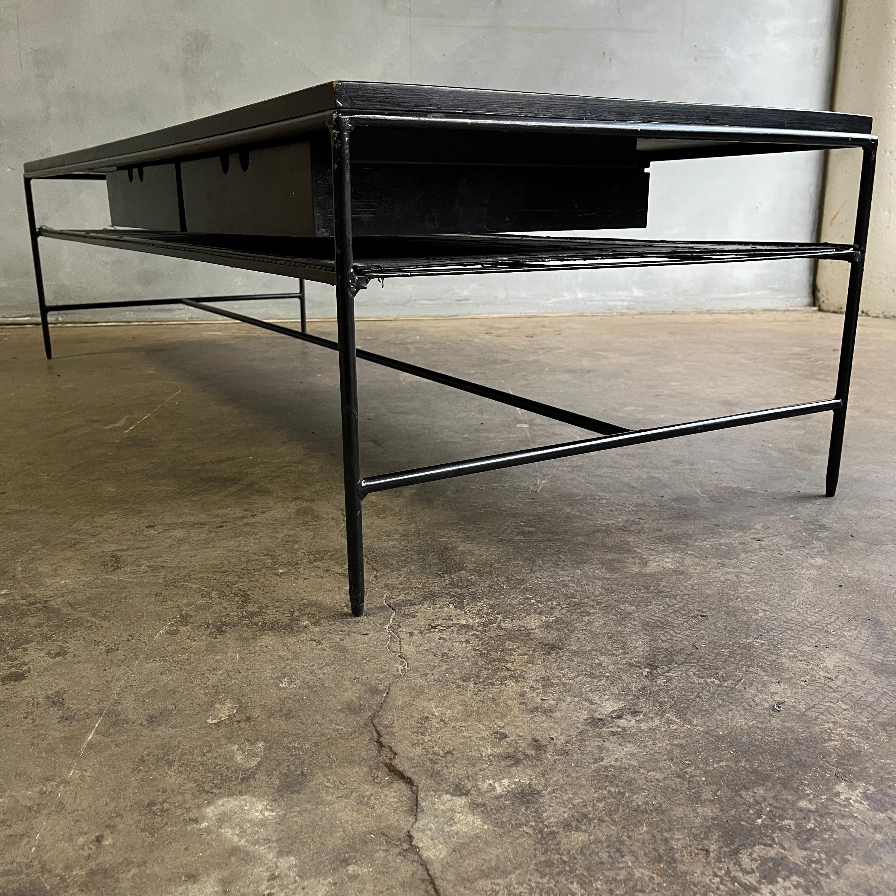 Beautiful Paul McCobb Planner Group #1584 - 60 inch coffee table bench all original black Lacquer finish, Minimalist Iron structure with 2 drawers all original all black finish. Very delicate designed coffee table with iron legs has lower tied slat
