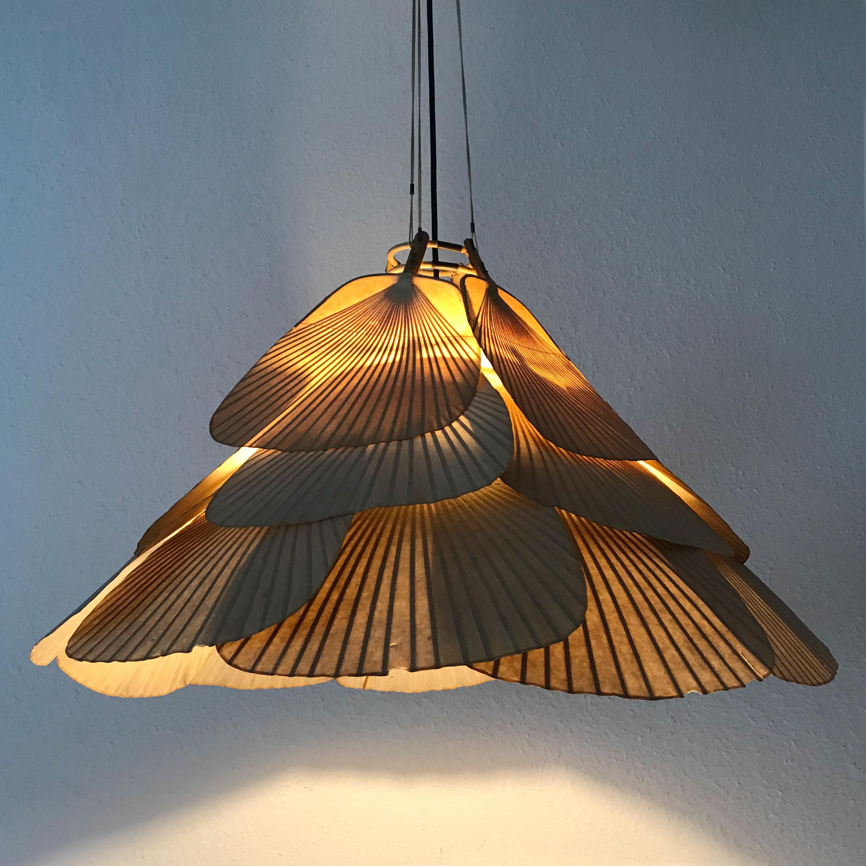 Exceptional, three-tiered Mid-Century Modern 'Uchiwa' bamboo fan chandelier or pendant lamp by Ingo Maurer for Design M, 1970s, Germany.

Executed in bamboo and rice paper. It needs 1 x E27 Edison screw fit bulbs. Delivery without bulbs. It runs