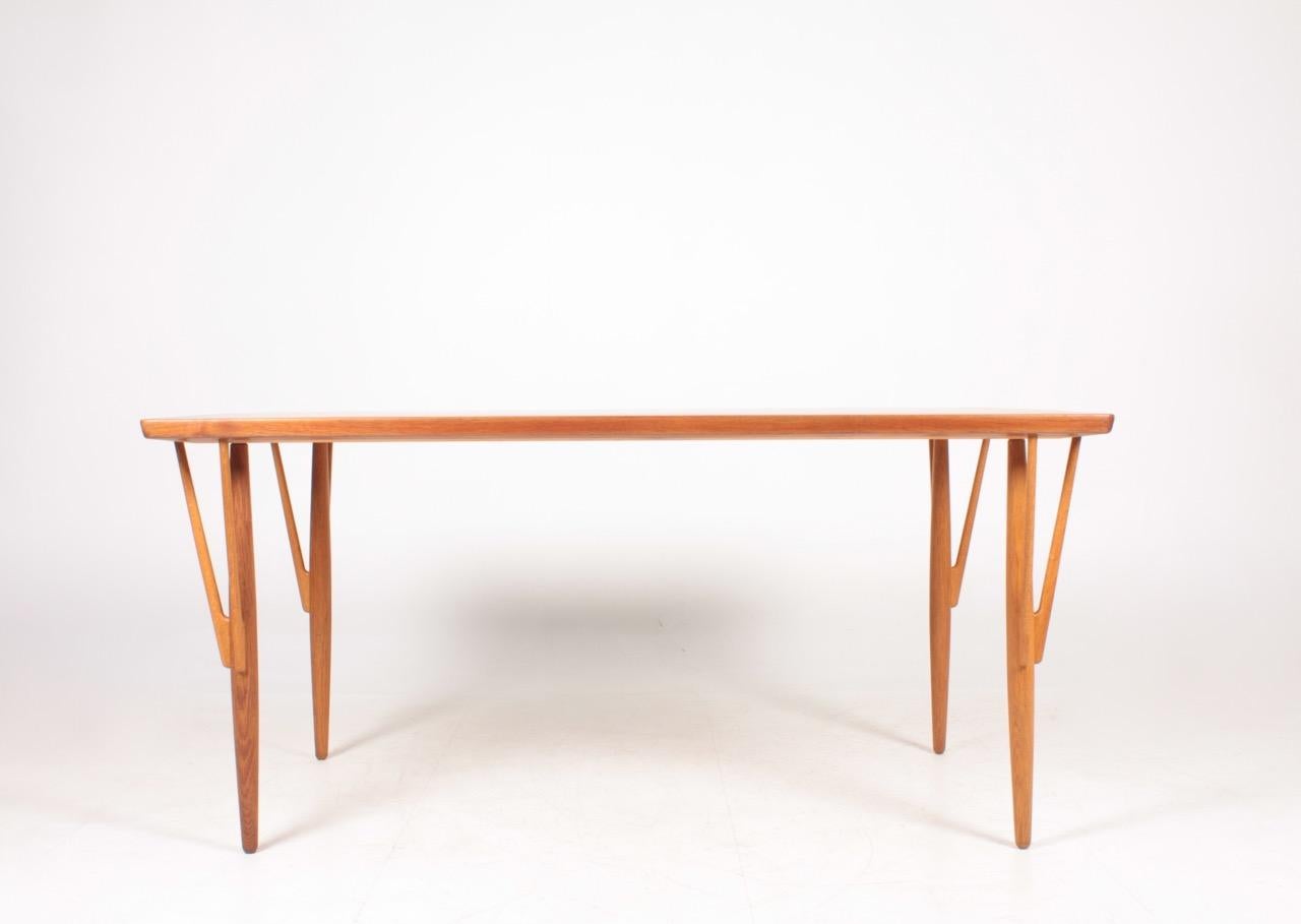 Rare table in teak and oak, designed by Hans J. Wegner and made by Johannes Hansen cabinetmakers Copenhagen, Denmark.