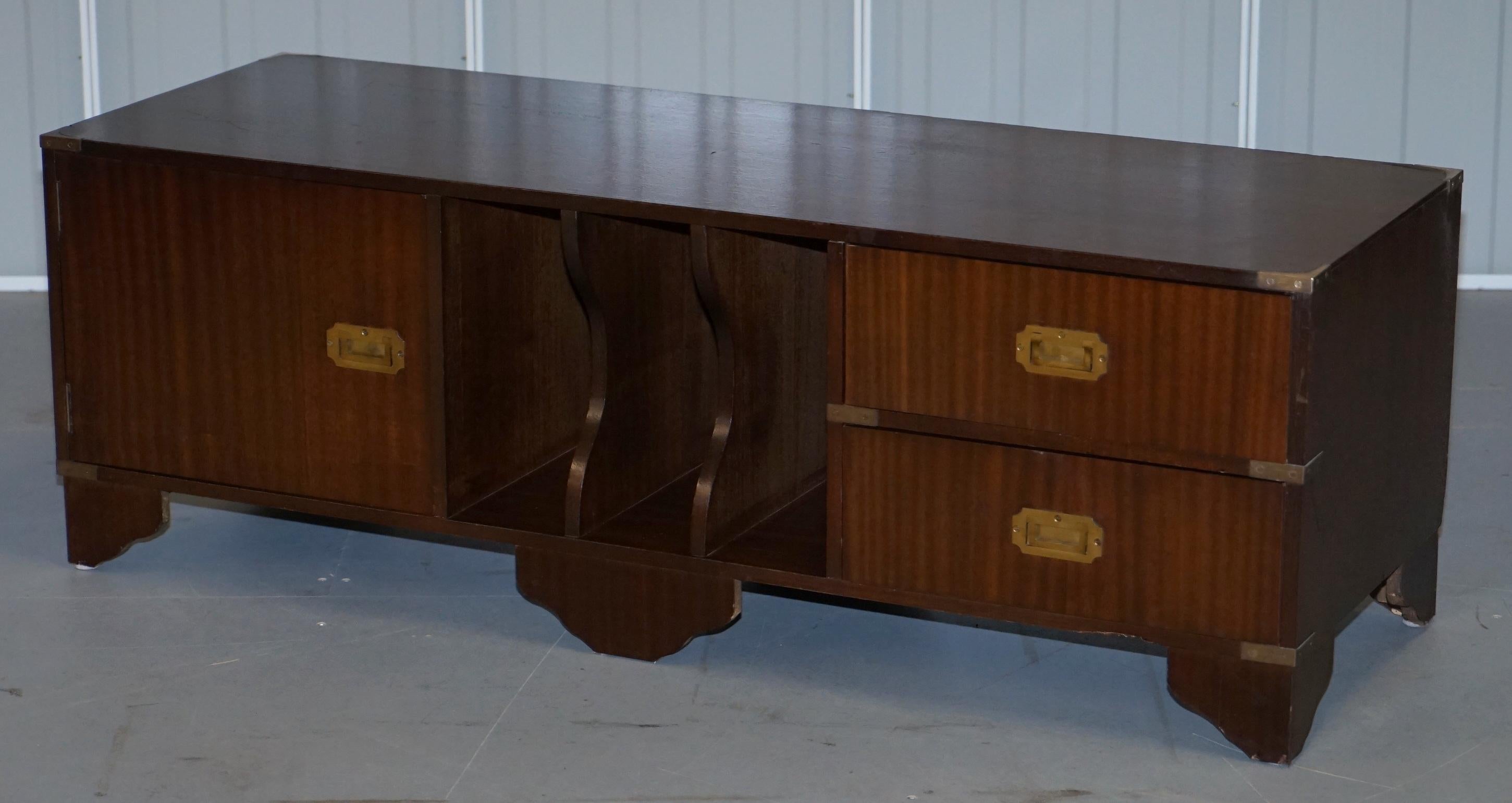 We are delighted to offer for sale this nice vintage Bevan Funnell Military Campaign media table with drawers

A very good looking and well made piece, originally designed as a media cabinet so it could house a record player and seat a television