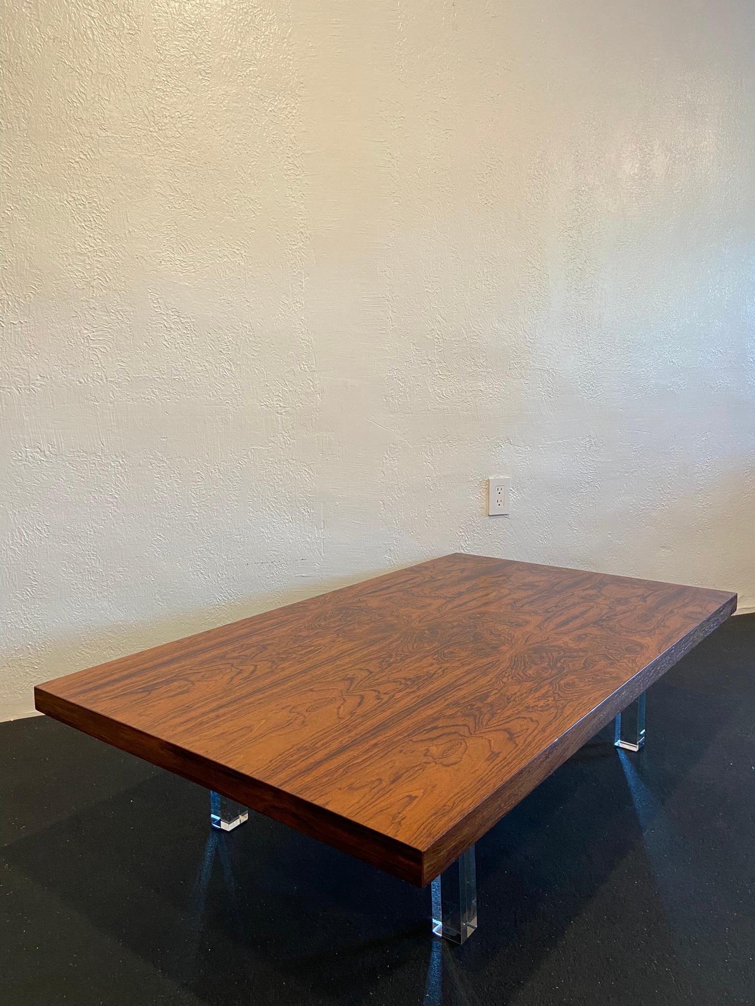 Rare Milo Baughman For Thayer Coggin rosewood coffee table on lucite legs. Likely a custom order, one off, order details found on label. Table has been refinished (please refer to photos). 

Would work well in a variety of interiors such as