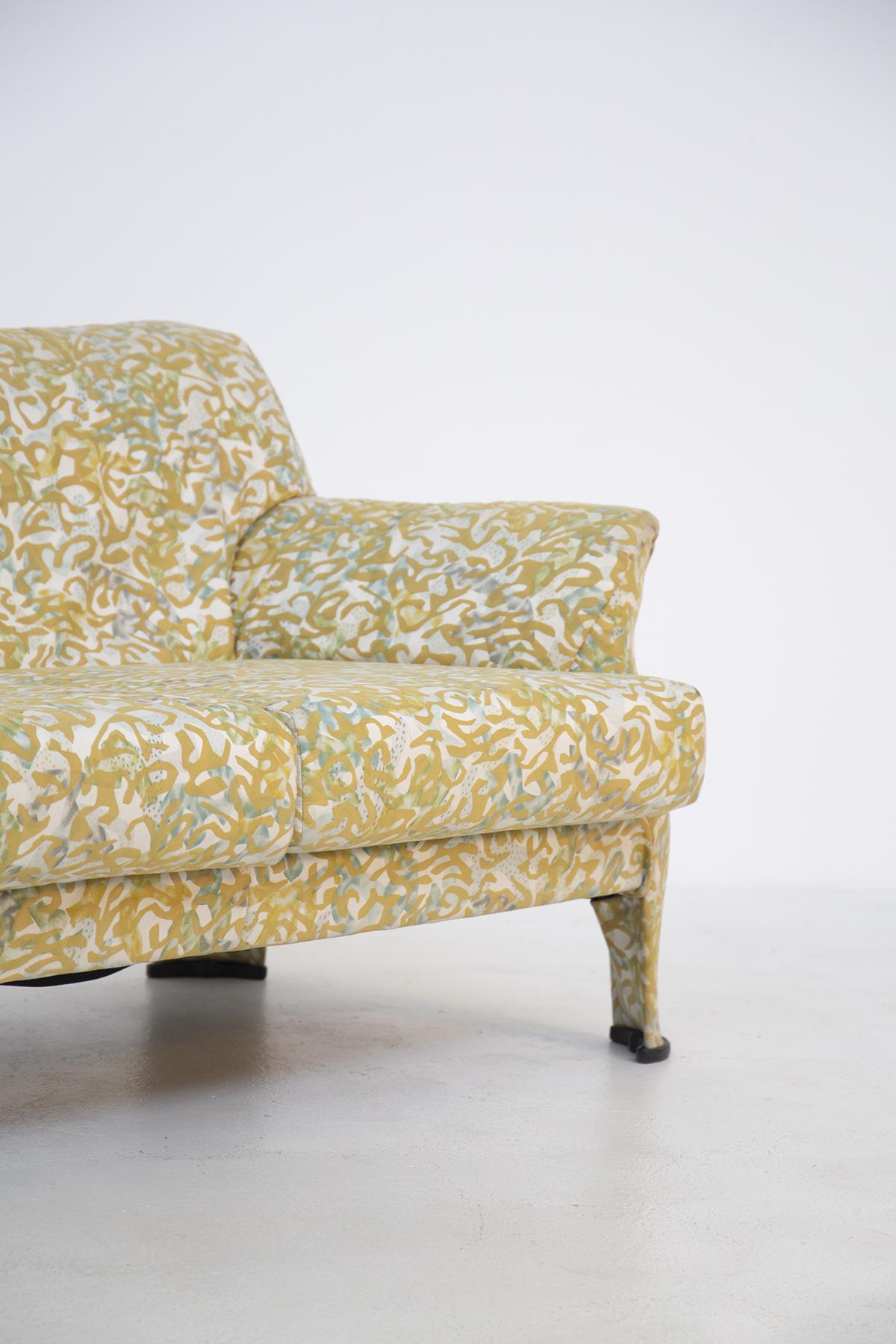 Rare sofa in the style of Milo Baughman in original fabric designed by Jake Lenor Larsen in the 1960s.
The fabric is in good and original vintage condition, the vintage sofa is a three seater. The fabric is colored yellow, teal on the ivory base.