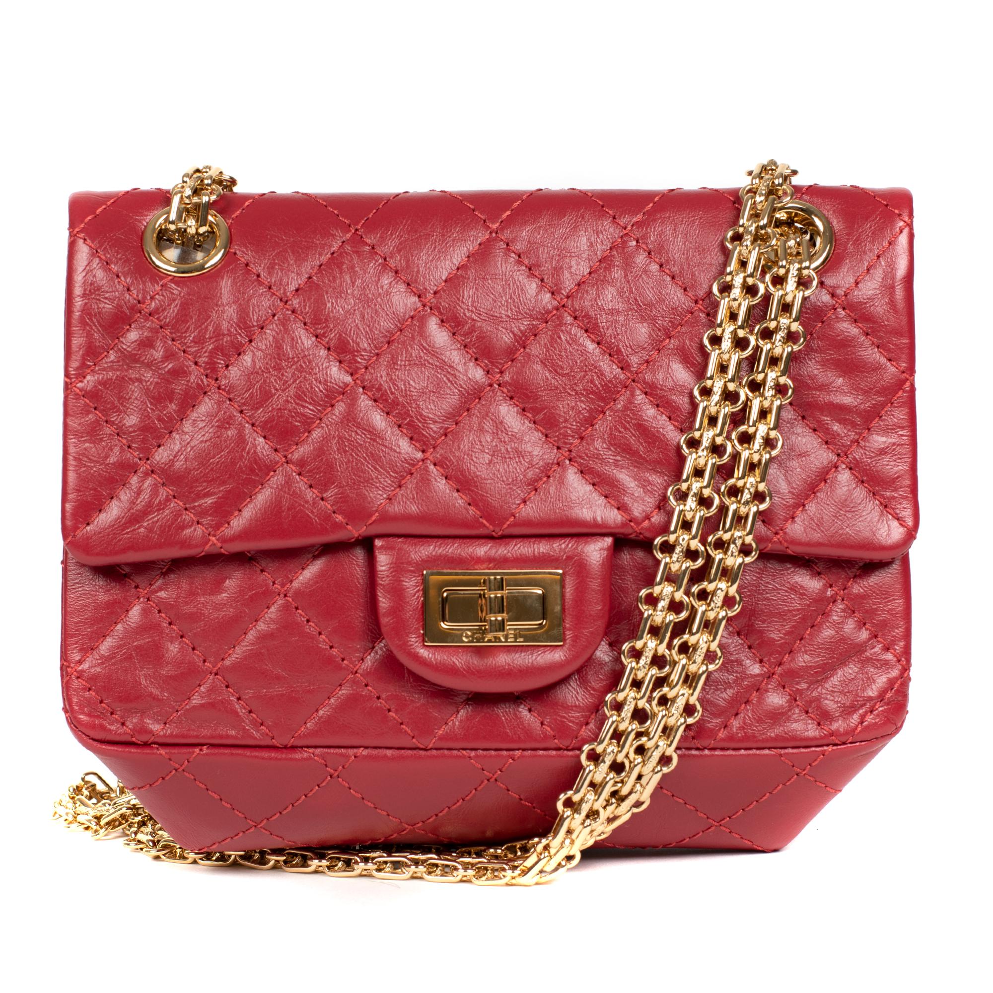 Pink Rare Mini Chanel 2.55 Reissue handbag in red quilted leather, gold hardware
