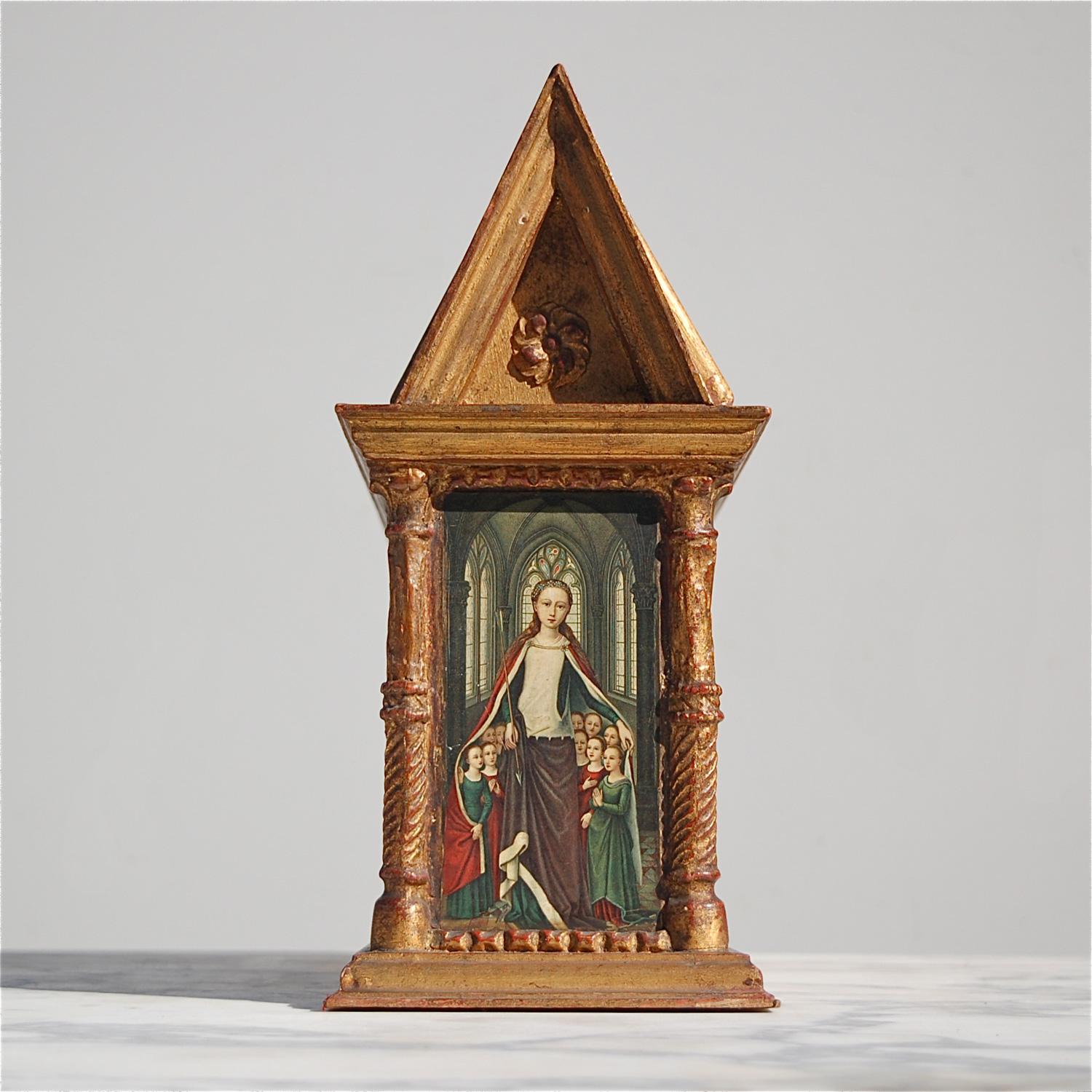 A rare, neo-gothic style miniature replica of the Sint Ursula shrine made by an unknown craftsman in the middle of the 20th century. It is constructed from oak and decorated with pillars, rosettes and other mouldings with patinated gold coloured