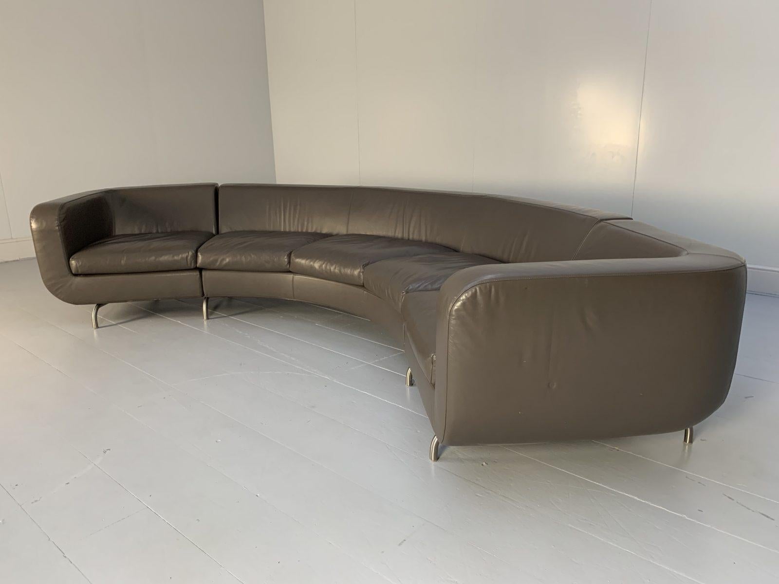 This is a superb, Minotti “Dubuffet” 5-Seat “Composition B” Curved Sofa, dressed in a peerless, top-grade “Pelle” Leather in Dark-Grey, and with Satin-Metal base and legs.

In a world of temporary pleasures, Minotti create beautiful furniture that